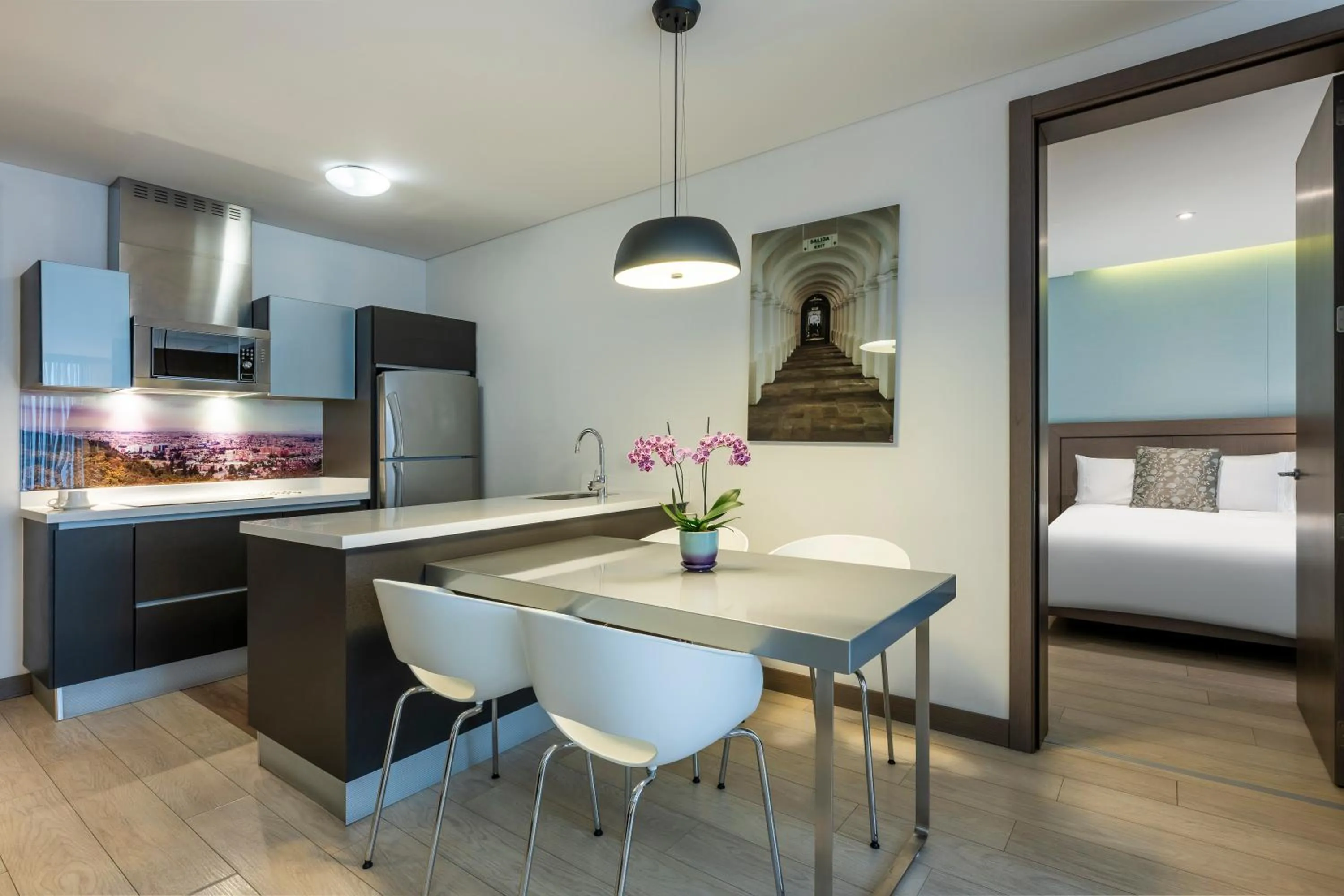 Bed in Hotel 100 Luxury Suites by Preferred