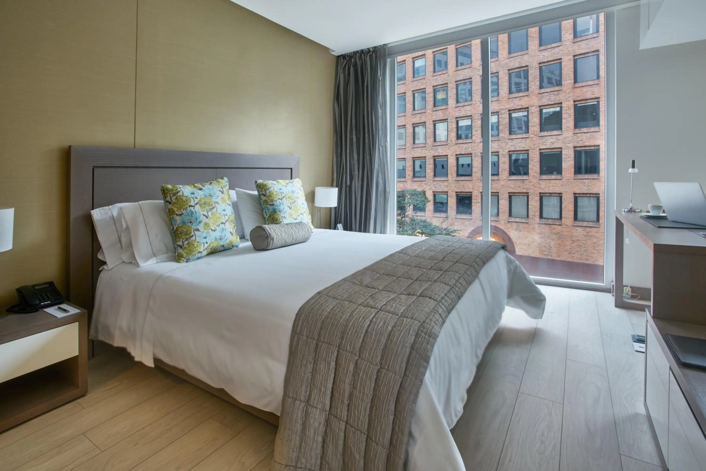 Bed in Hotel 100 Luxury Suites by Preferred