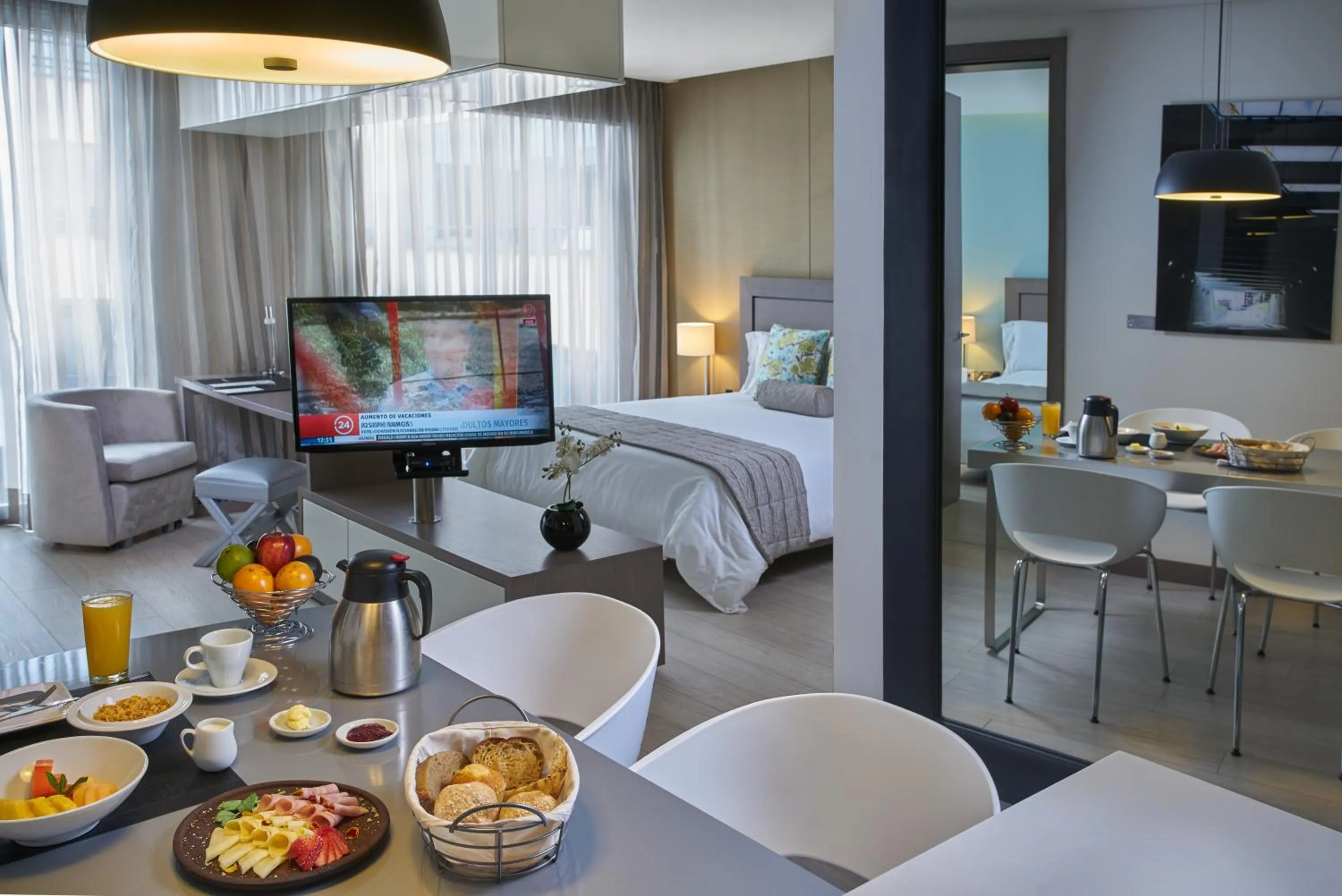 Bed in Hotel 100 Luxury Suites by Preferred