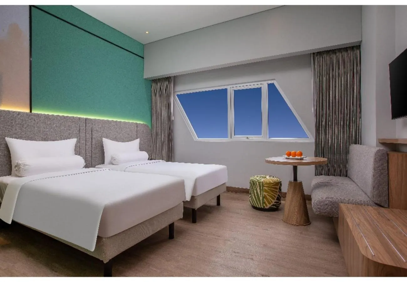 Bed in Harper Banjarmasin by ASTON