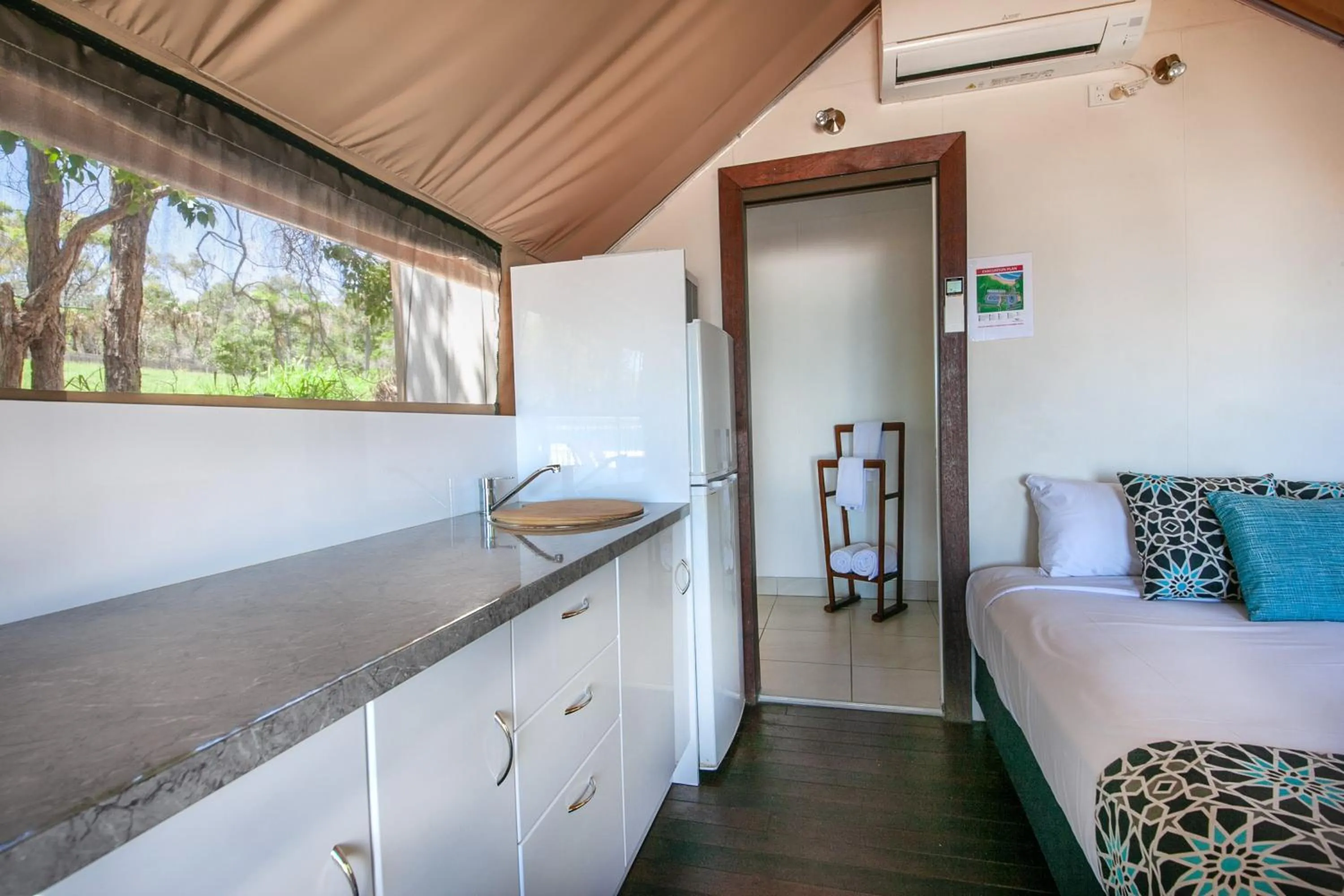 Kitchen or kitchenette, Bed in NRMA Agnes Water Holiday Park