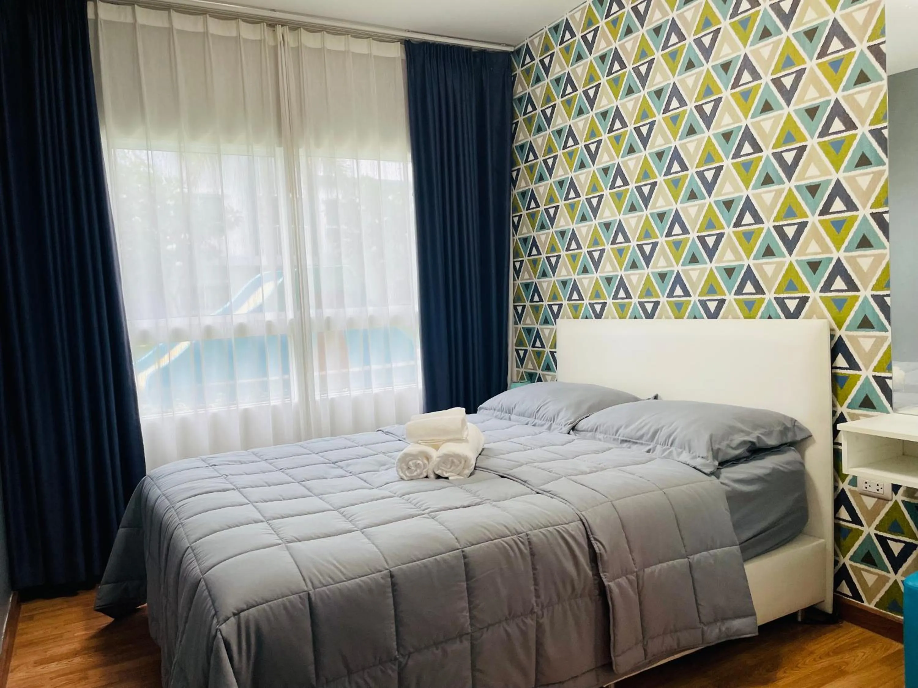 Bed in The Trust Condo by the Sea