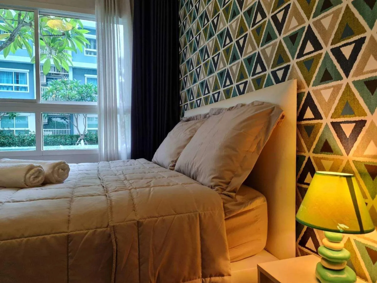 Bed in The Trust Condo by the Sea