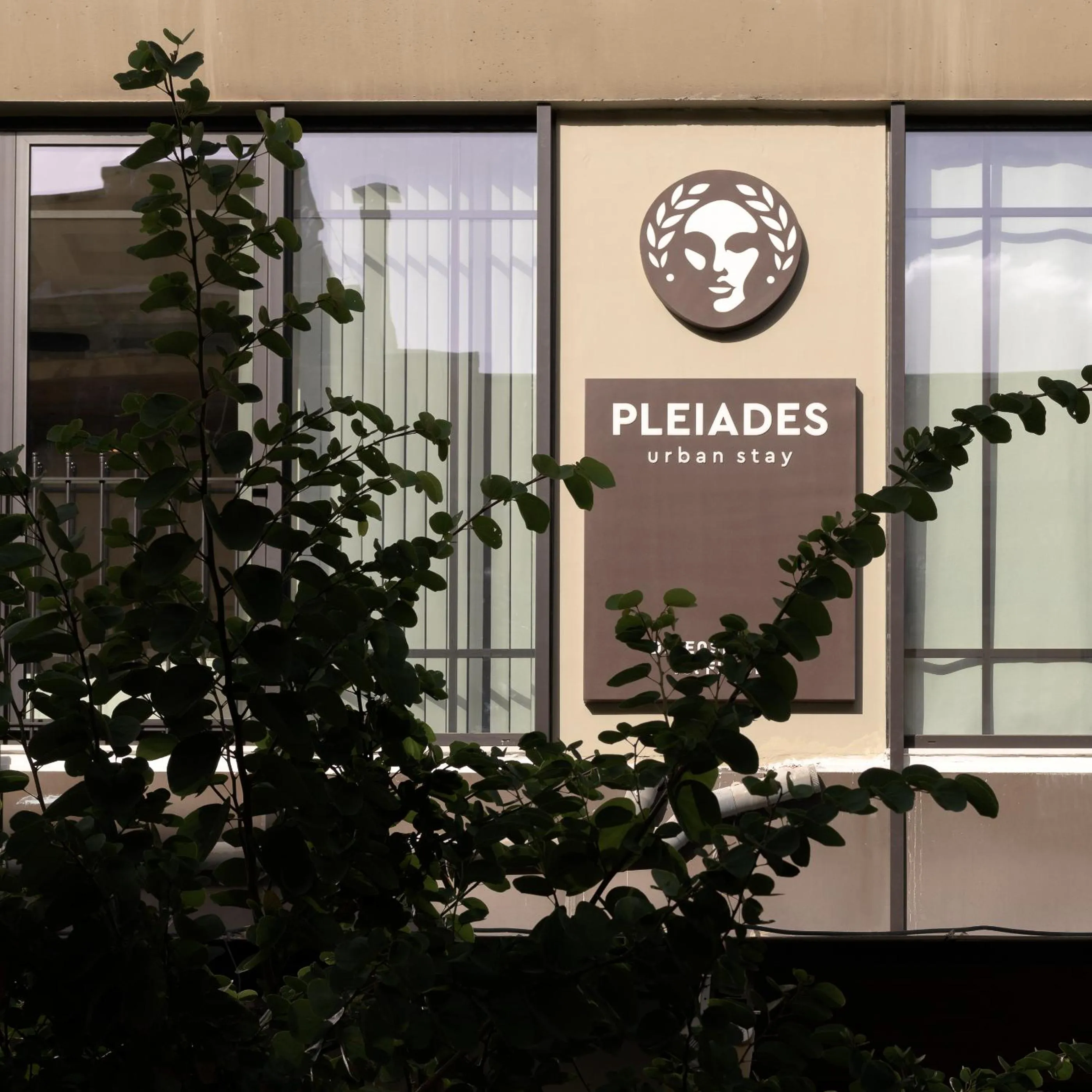 Property logo or sign in Pleiades Urban Stay by Semavί
