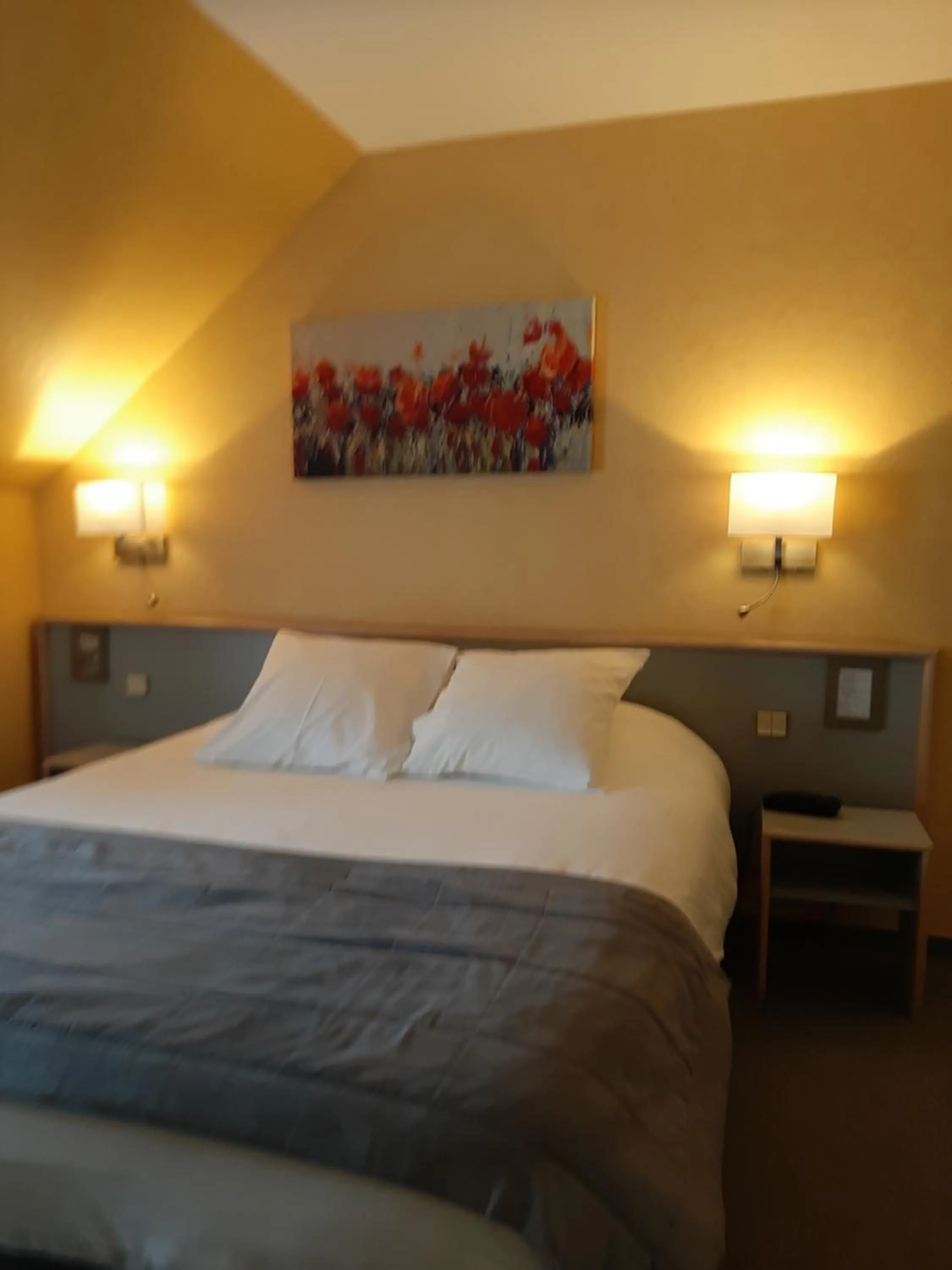 Bed in Au Relais de l'Oust