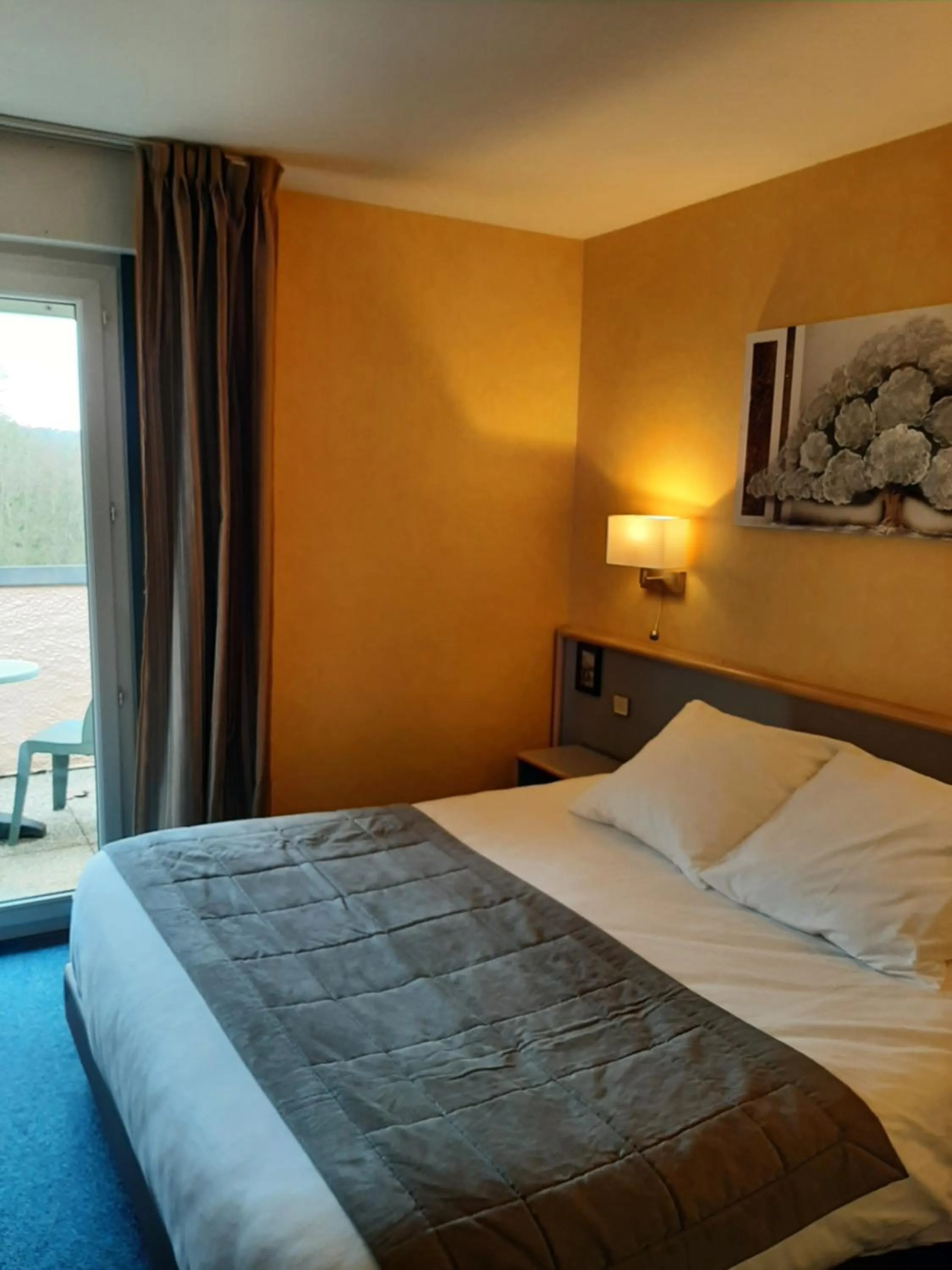 Bed in Au Relais de l'Oust