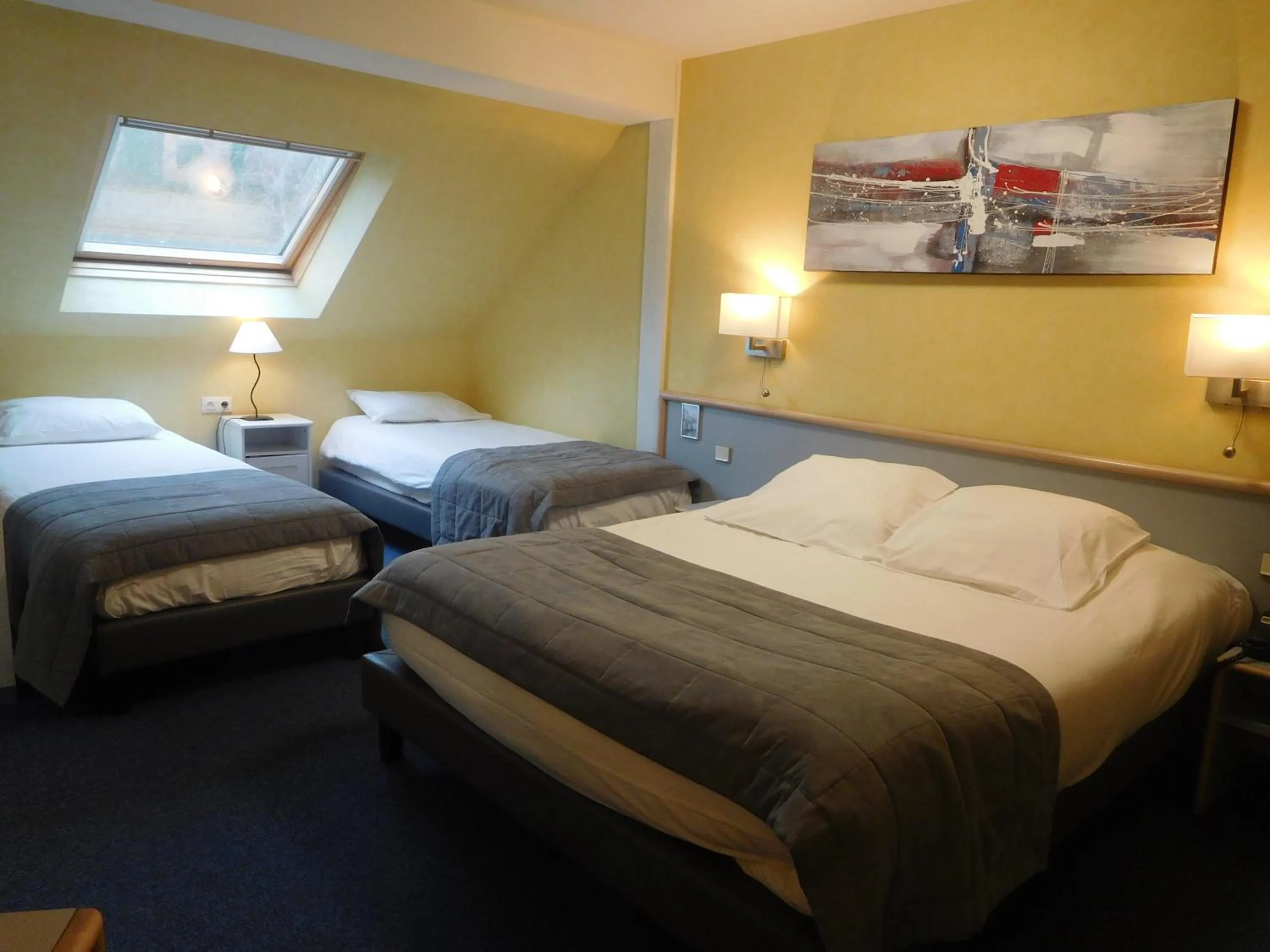 Bed in Au Relais de l'Oust