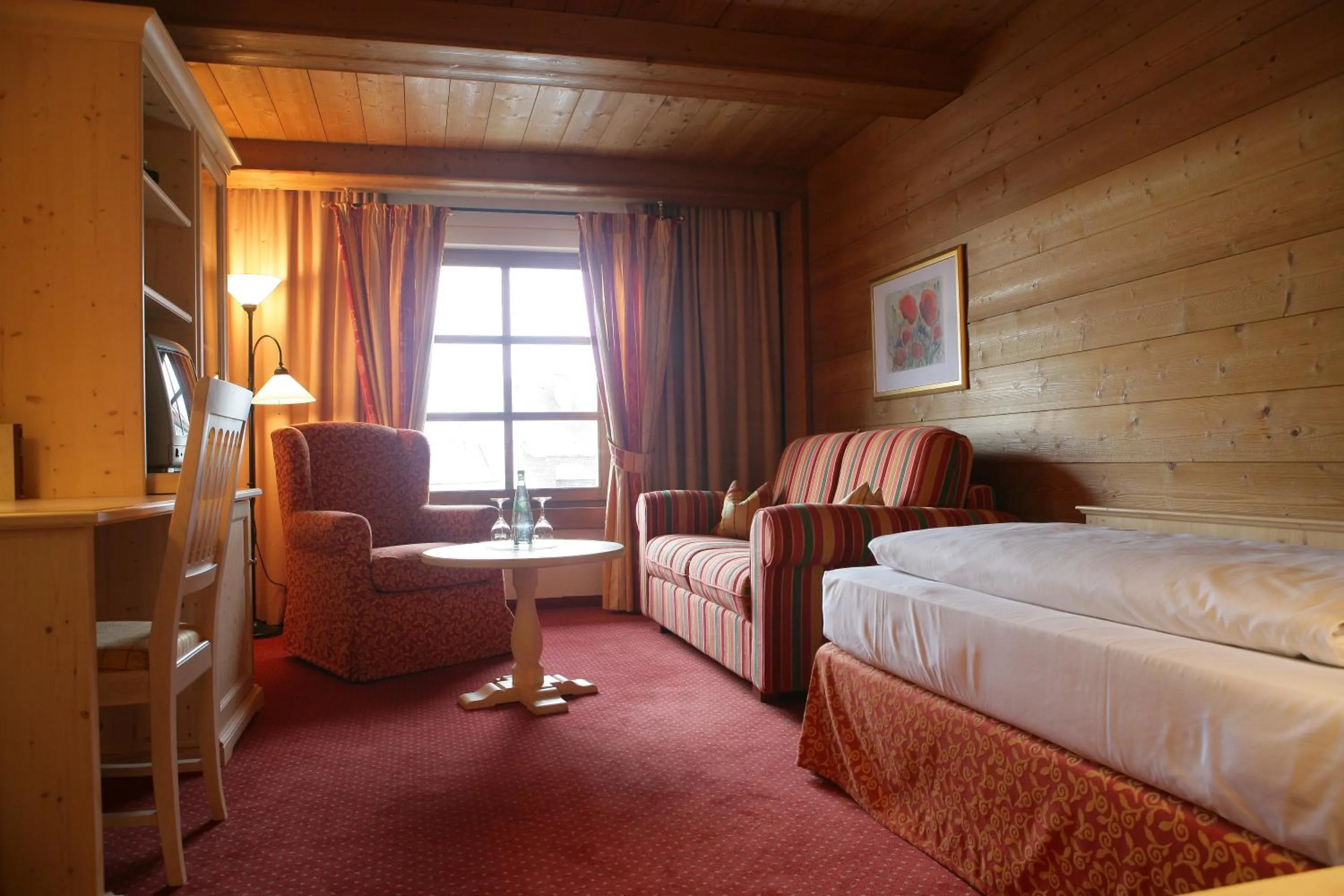 Photo of the whole room, Bed in Hotel Gasthof Alte Post Holzkirchen