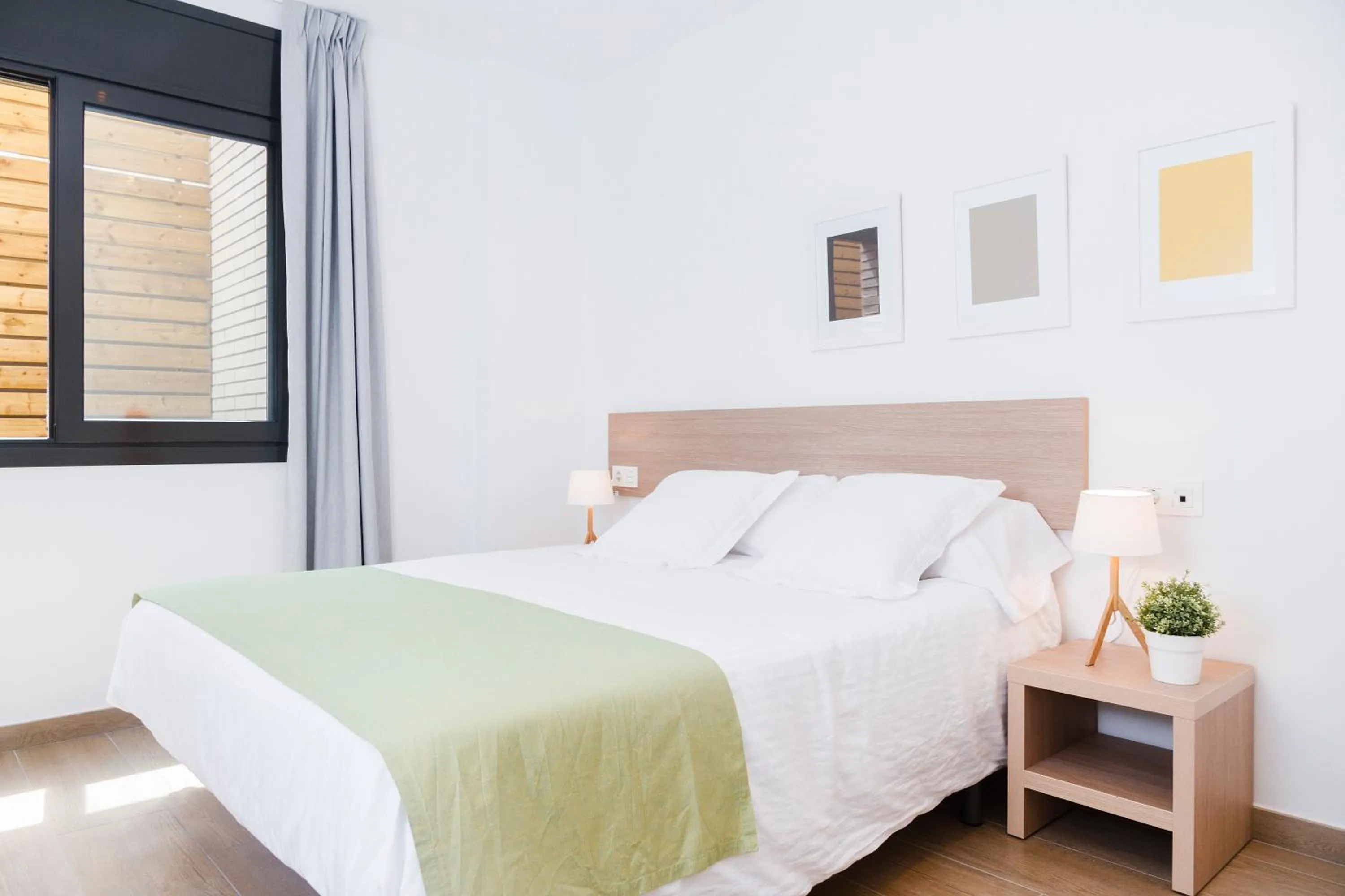 Bed in Feelathome Plaza Apartments