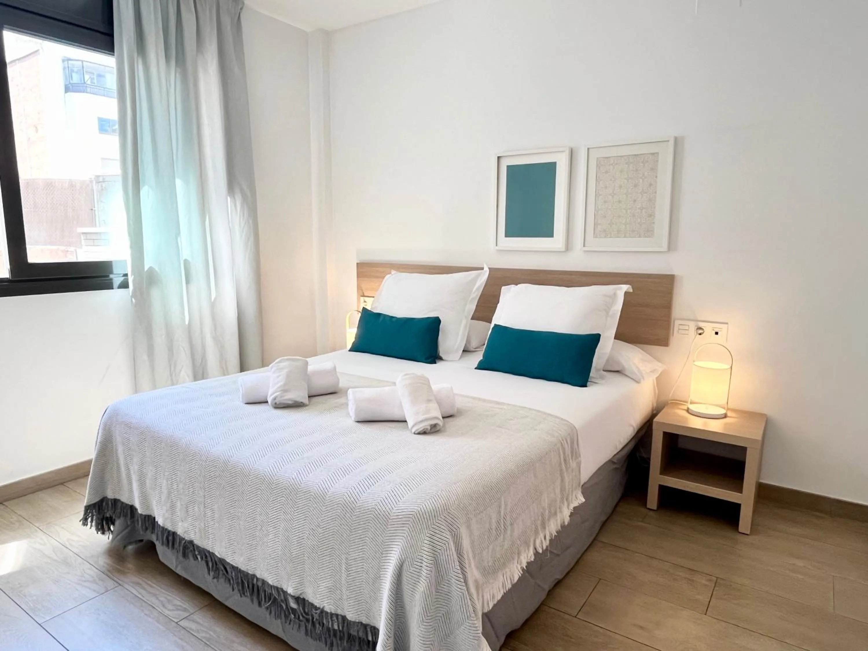 Bedroom, Bed in Feelathome Plaza Apartments