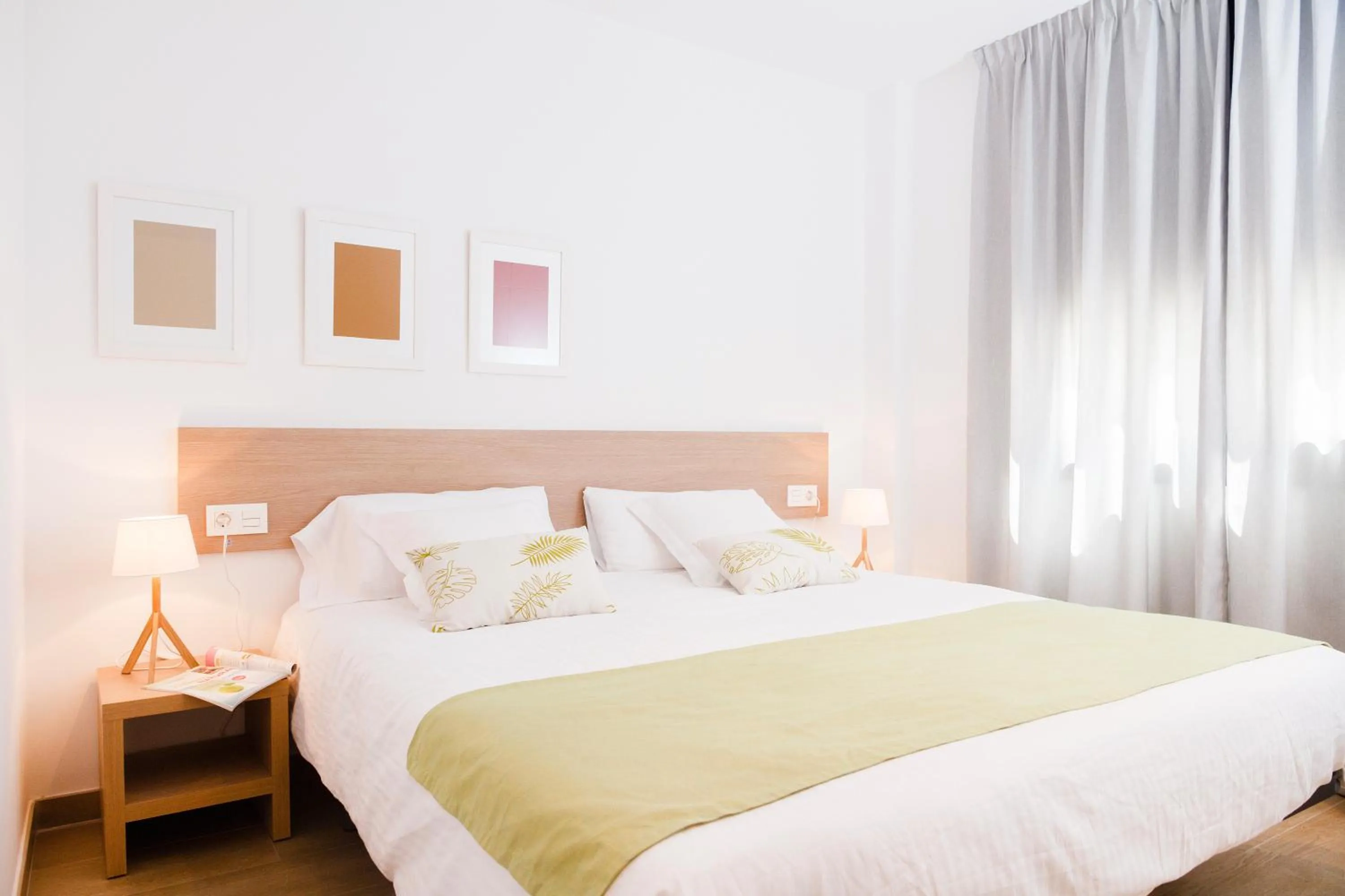 Bed in Feelathome Plaza Apartments