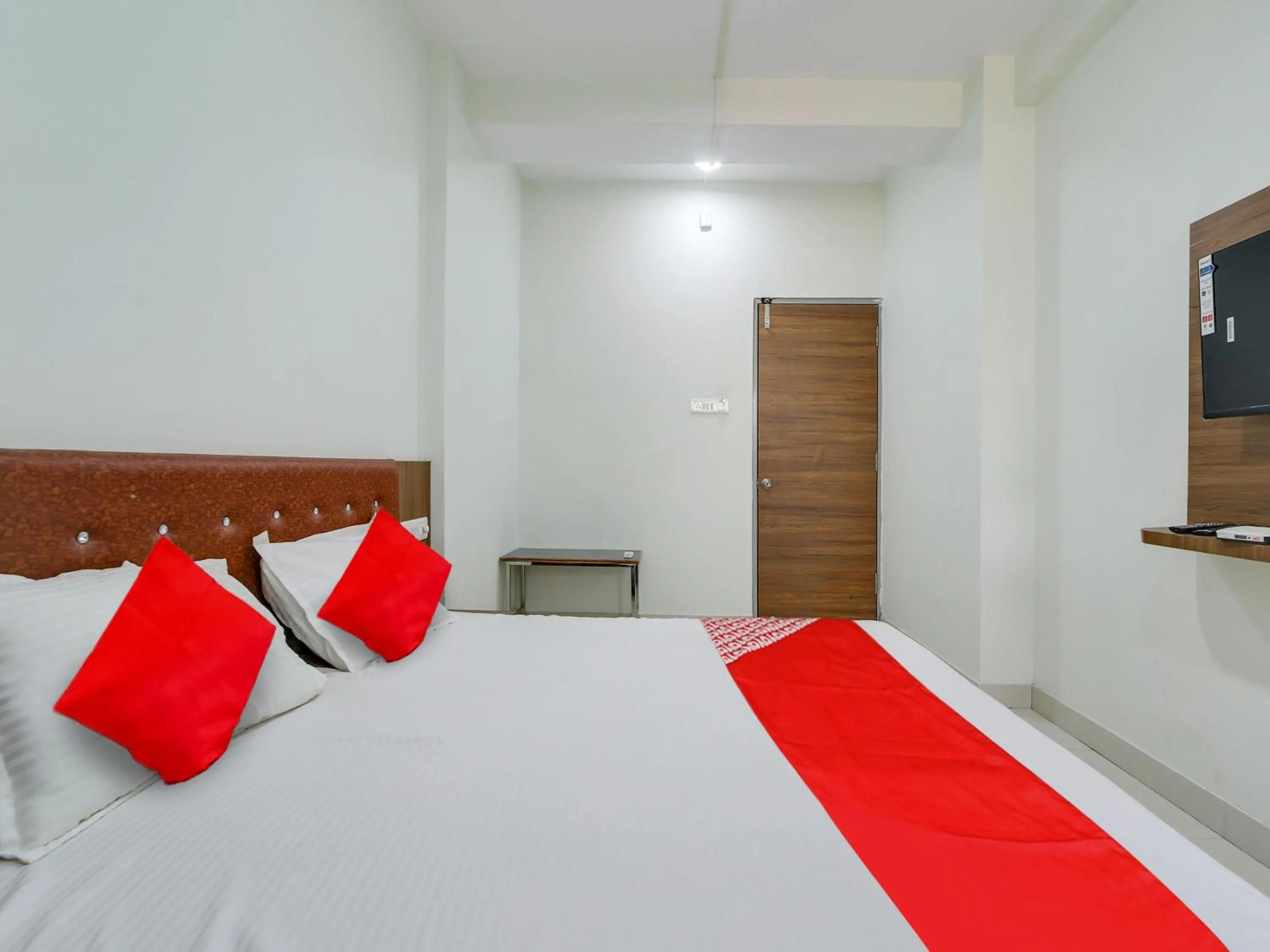 Bedroom in Super Hotel O Lalit And Marriage Garden