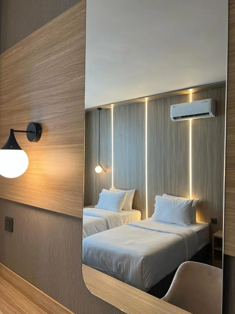 Bed in Royal Mass Airport Business Hotel