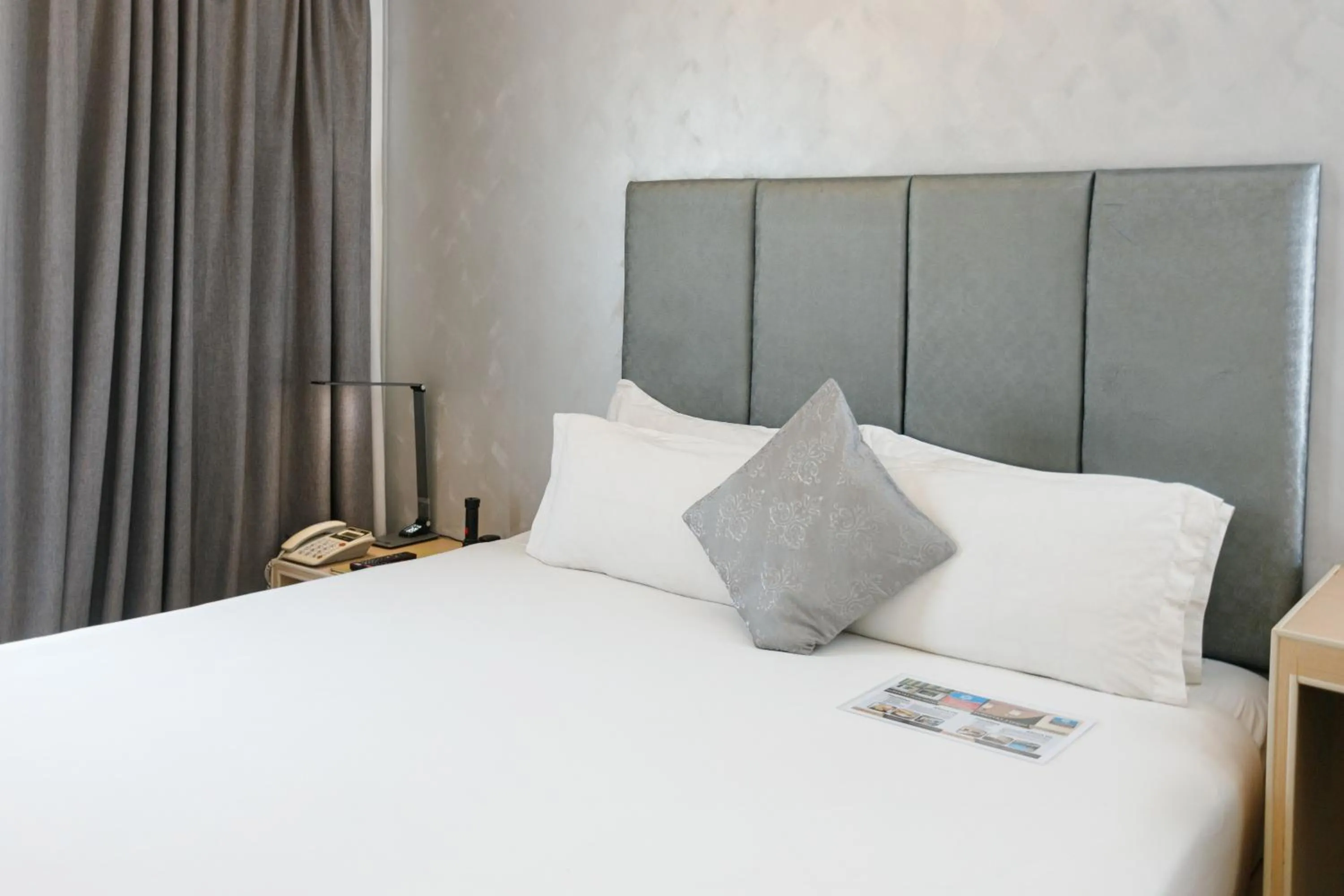 Bed in Regency Grand Suites