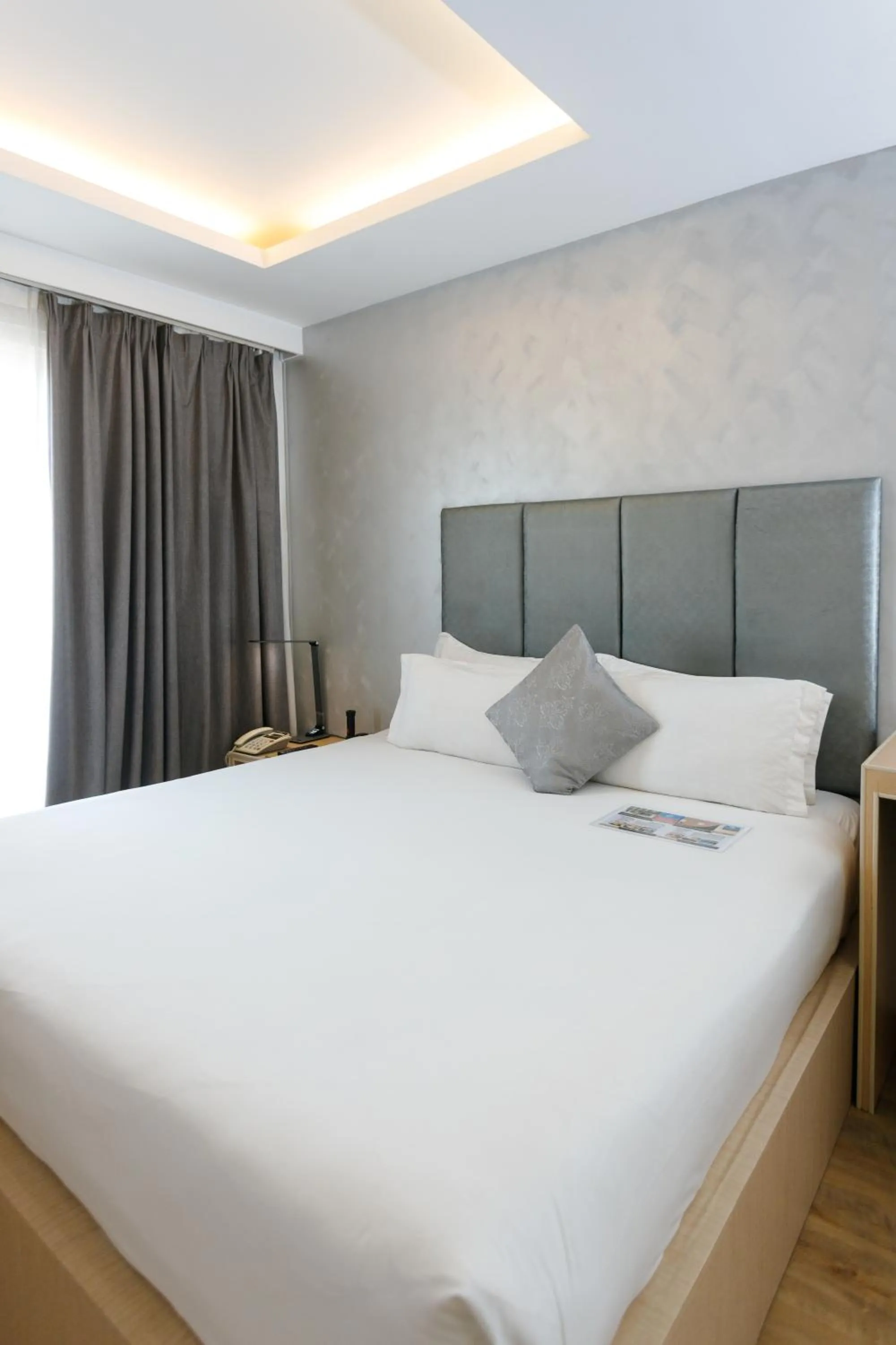 Bed in Regency Grand Suites