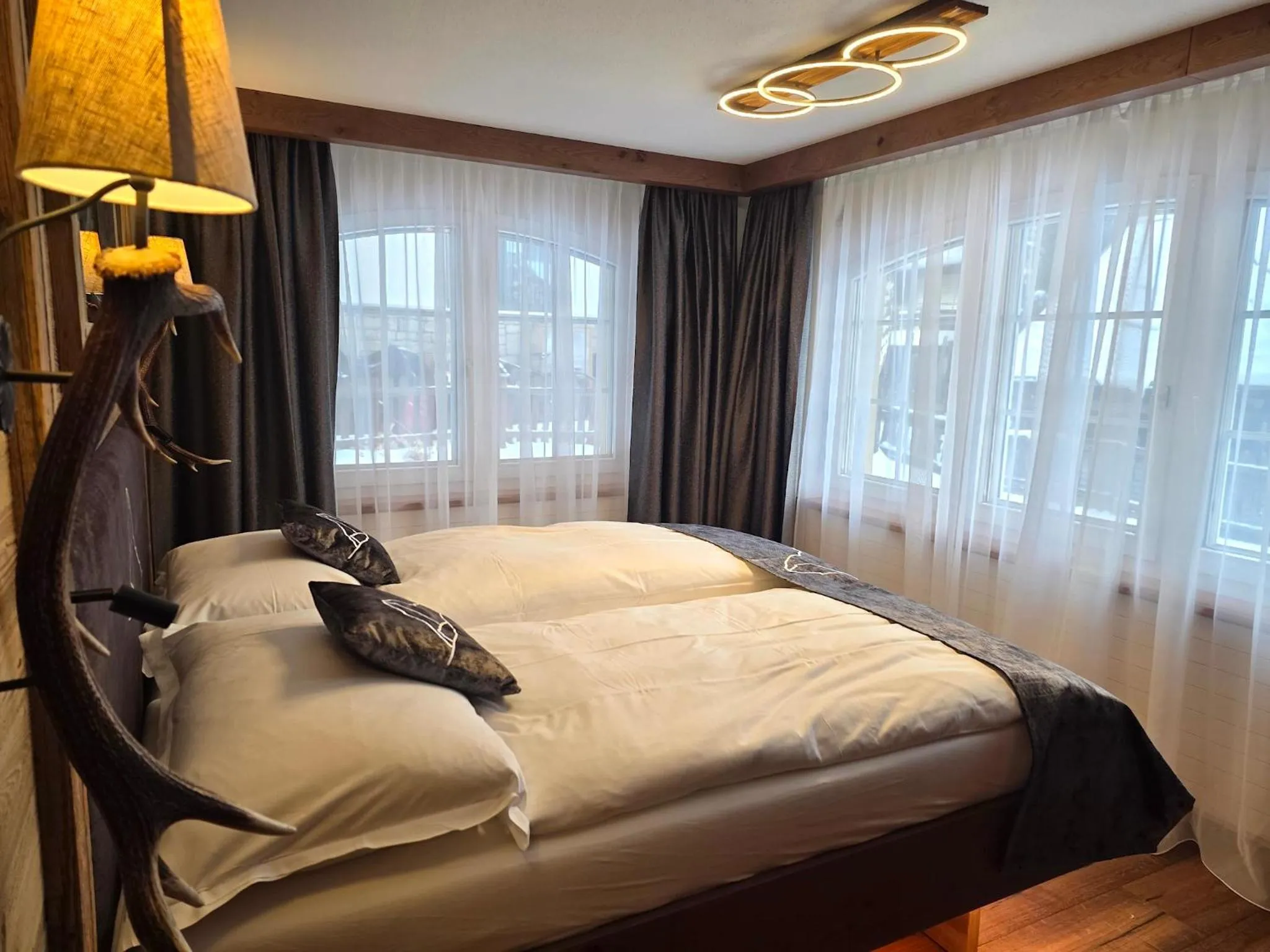 Bed in La Perle Apartments