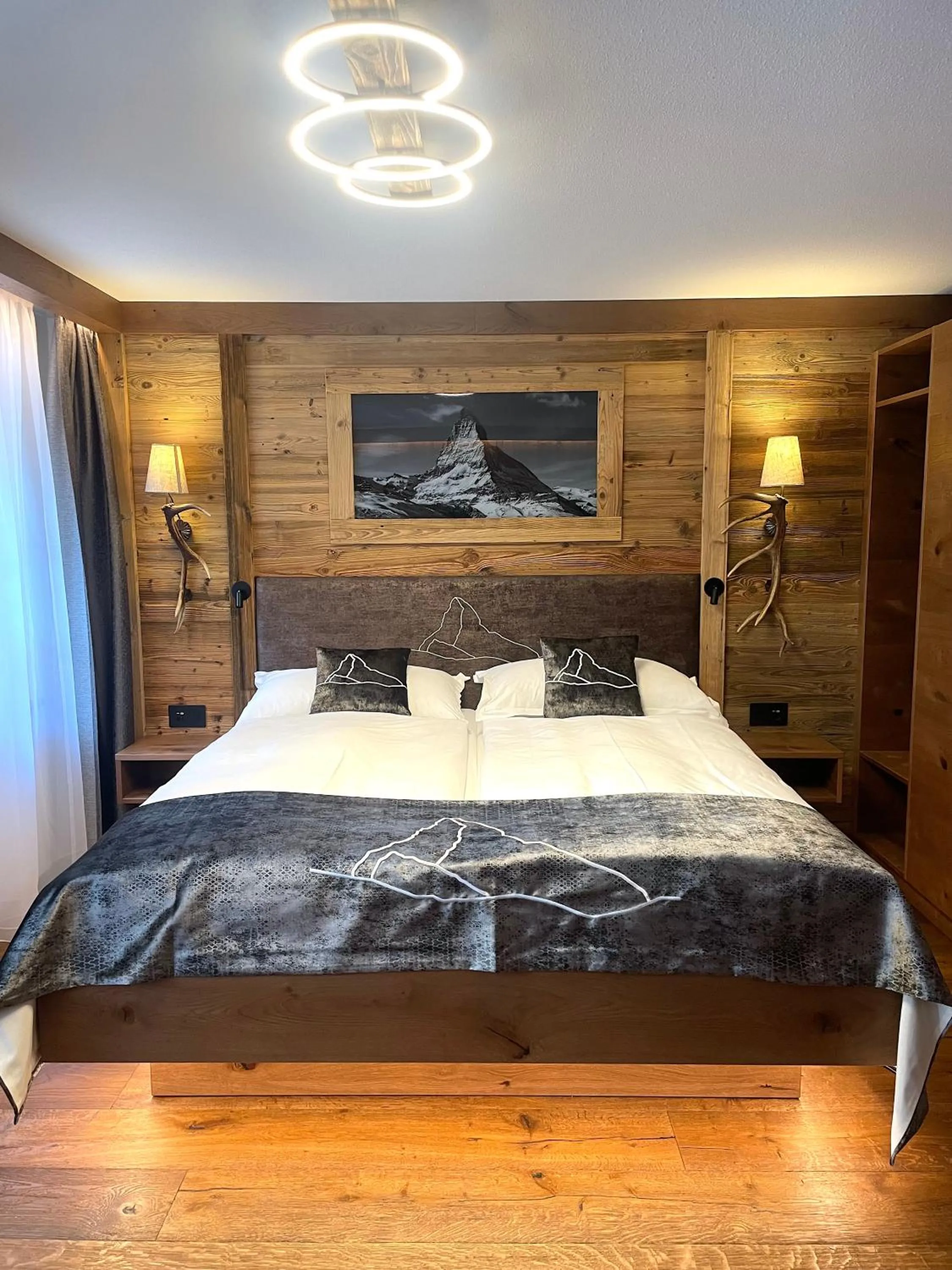 Bed in La Perle Apartments