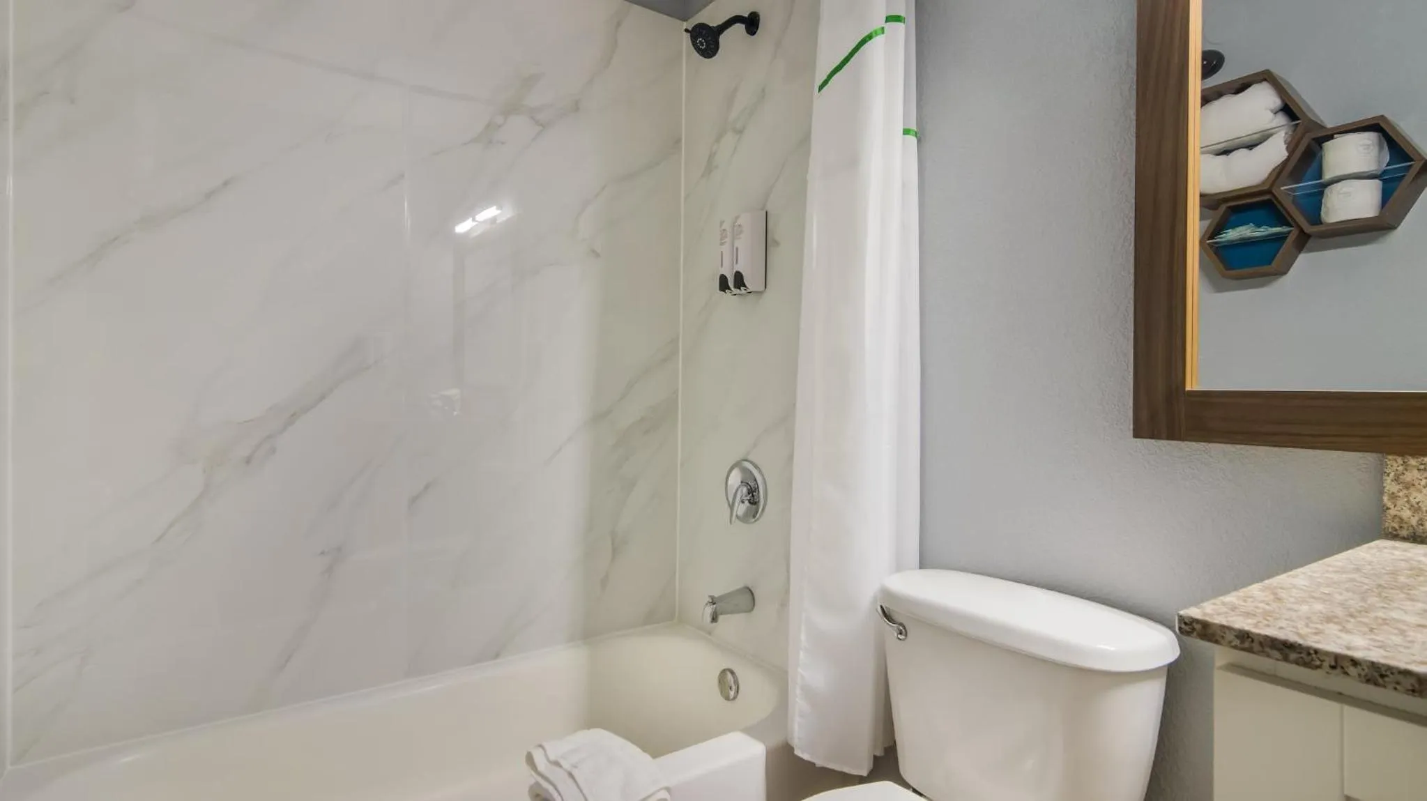 Bathroom in HomeTowne Studios by Red Roof and Conference Center Chicago - N Aurora Naperville