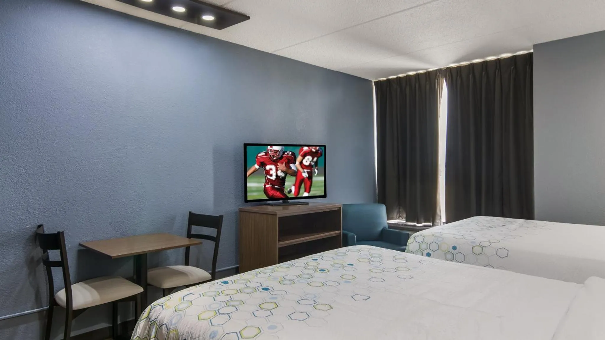 Photo of the whole room, Bed in HomeTowne Studios by Red Roof and Conference Center Chicago - N Aurora Naperville