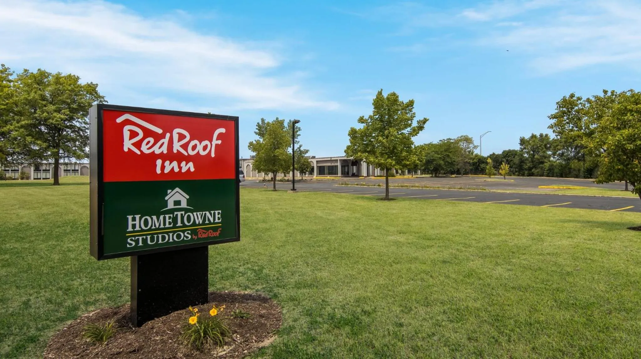 Property building in HomeTowne Studios by Red Roof and Conference Center Chicago - N Aurora Naperville