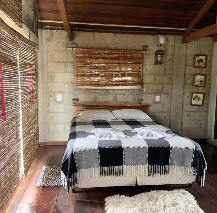 Bed in Pousada Rota dos Pássaros