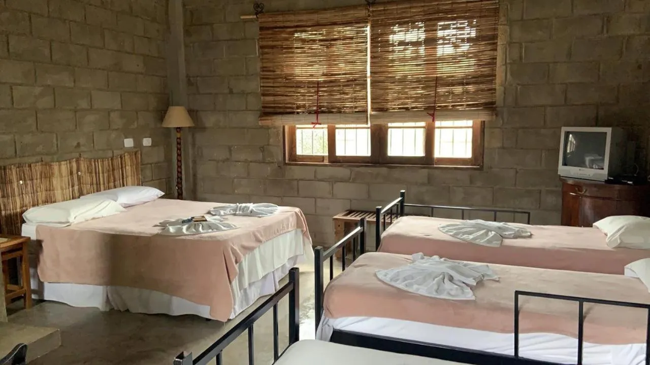 Bed in Pousada Rota dos Pássaros