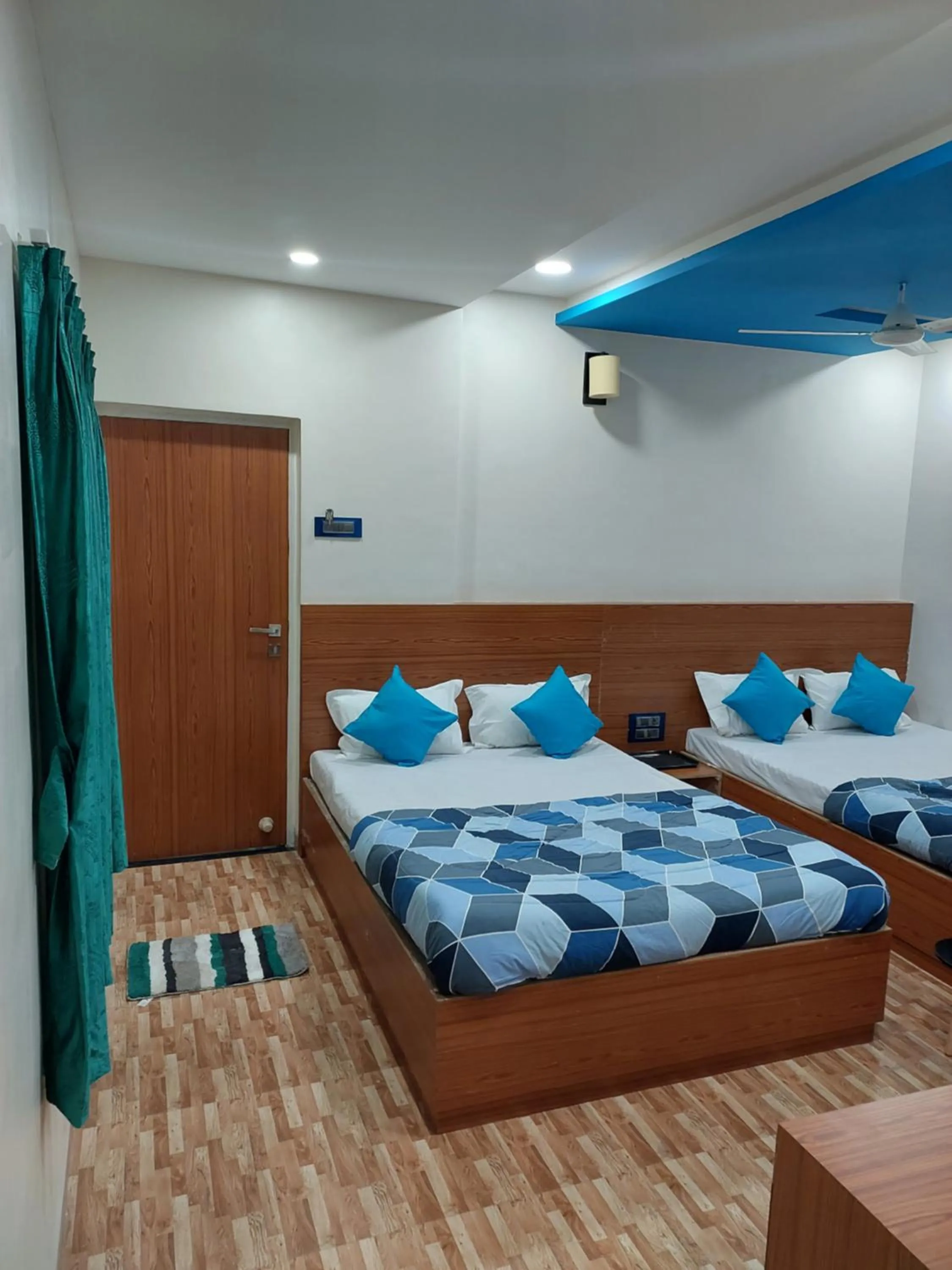 Bed in Hotel Sai Dakshina Inn & The Fern Restaurant