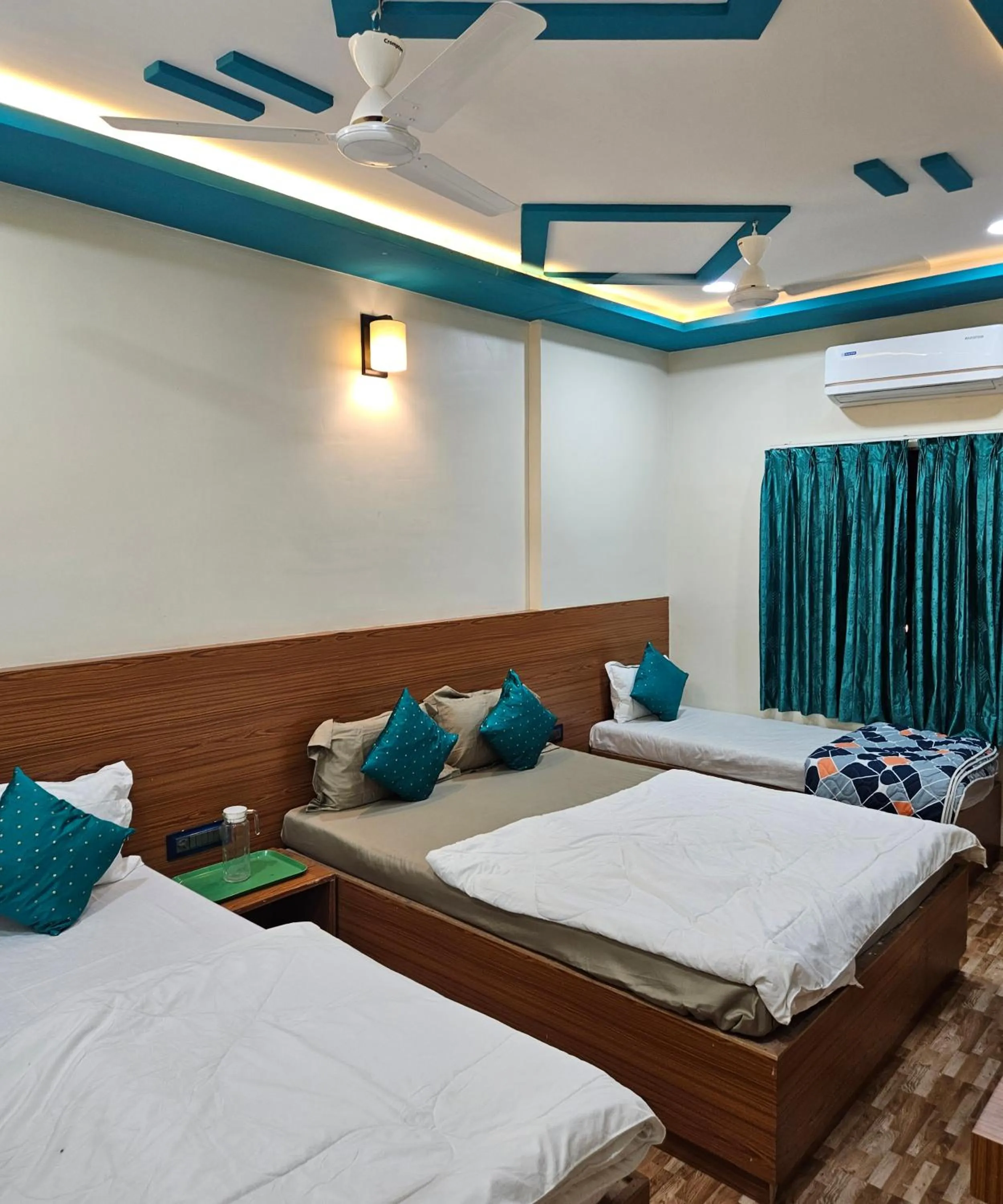 Bed in Hotel Sai Dakshina Inn & The Fern Restaurant