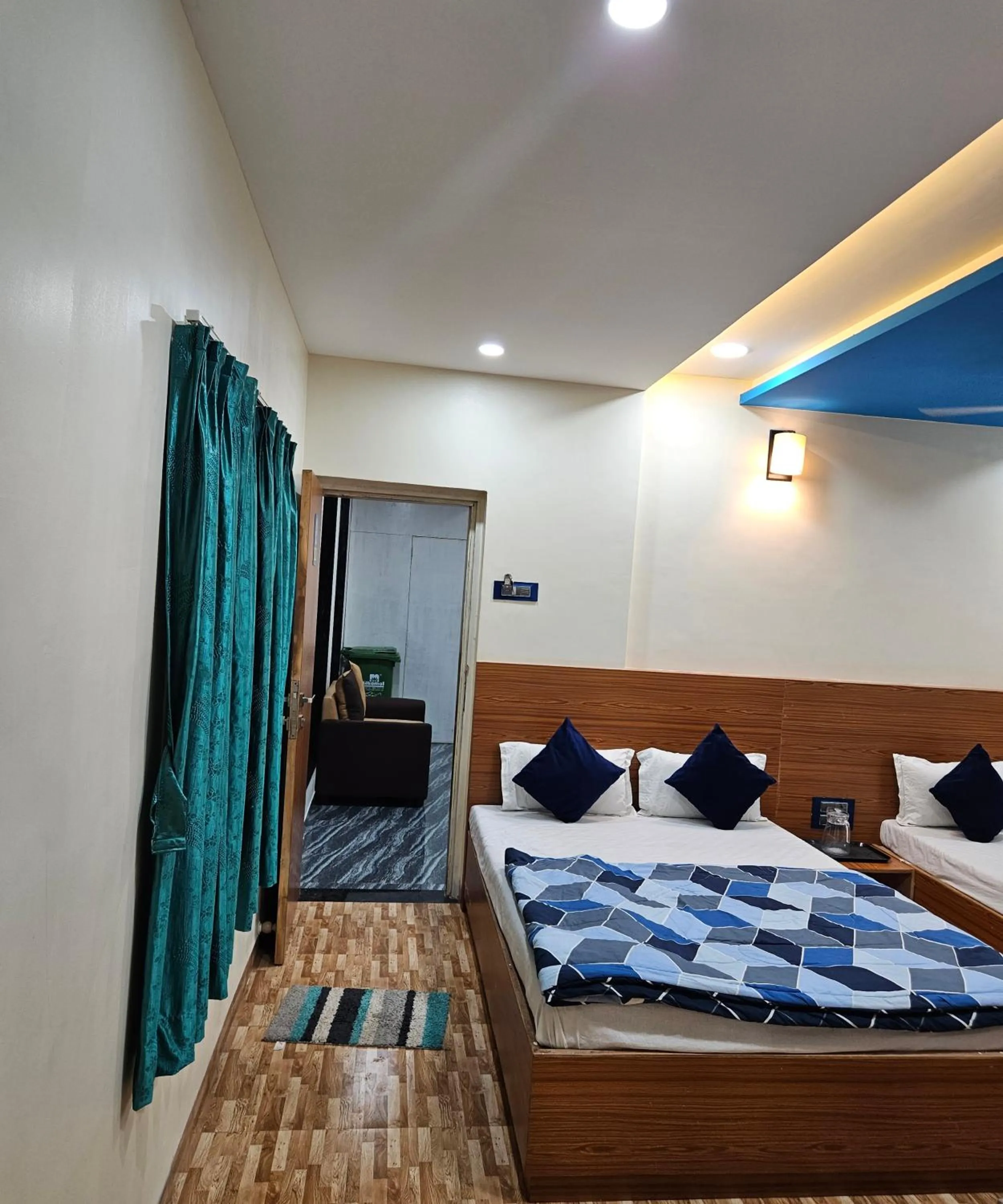 Bed in Hotel Sai Dakshina Inn & The Fern Restaurant