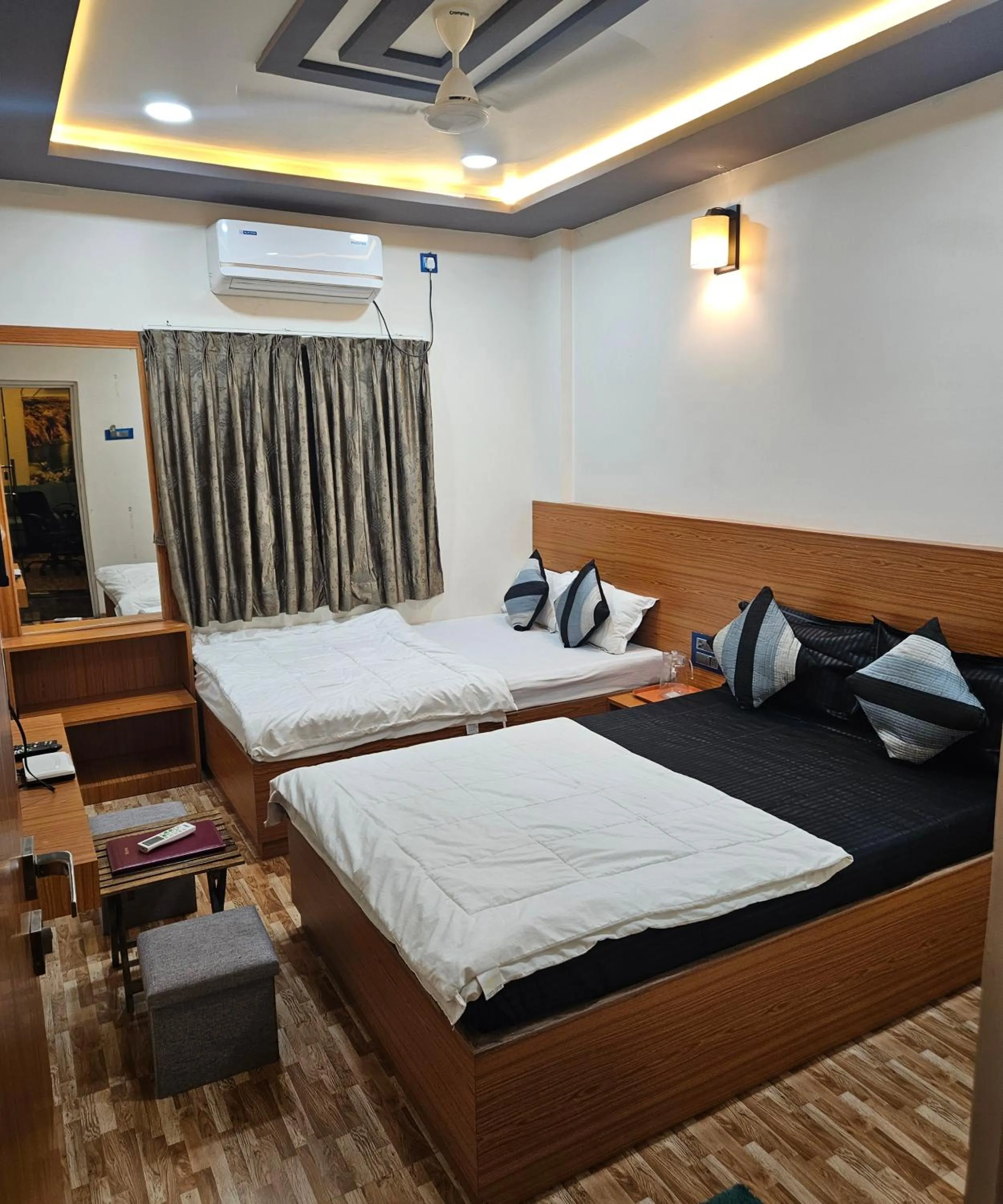 Bed in Hotel Sai Dakshina Inn & The Fern Restaurant