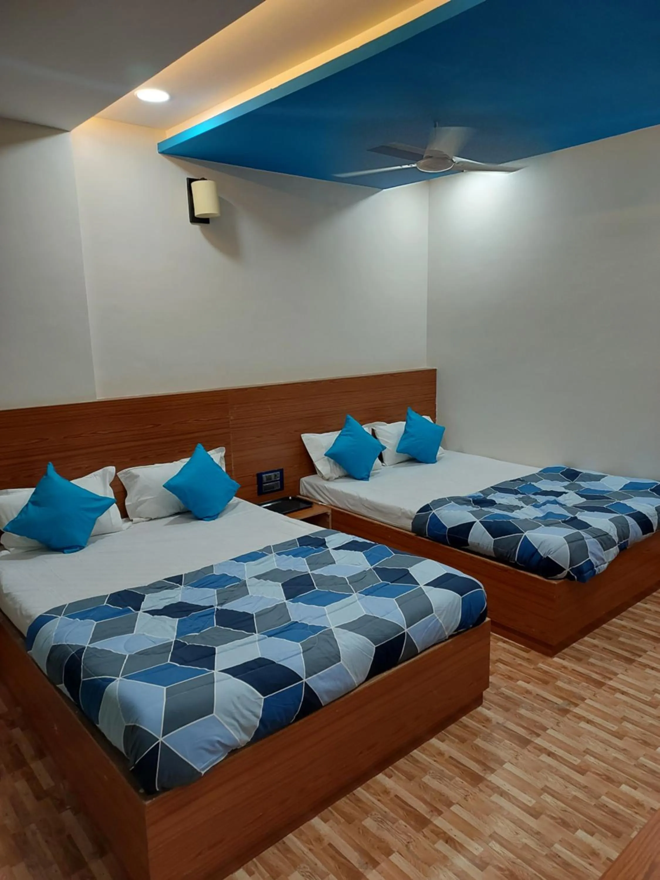 Bed in Hotel Sai Dakshina Inn & The Fern Restaurant