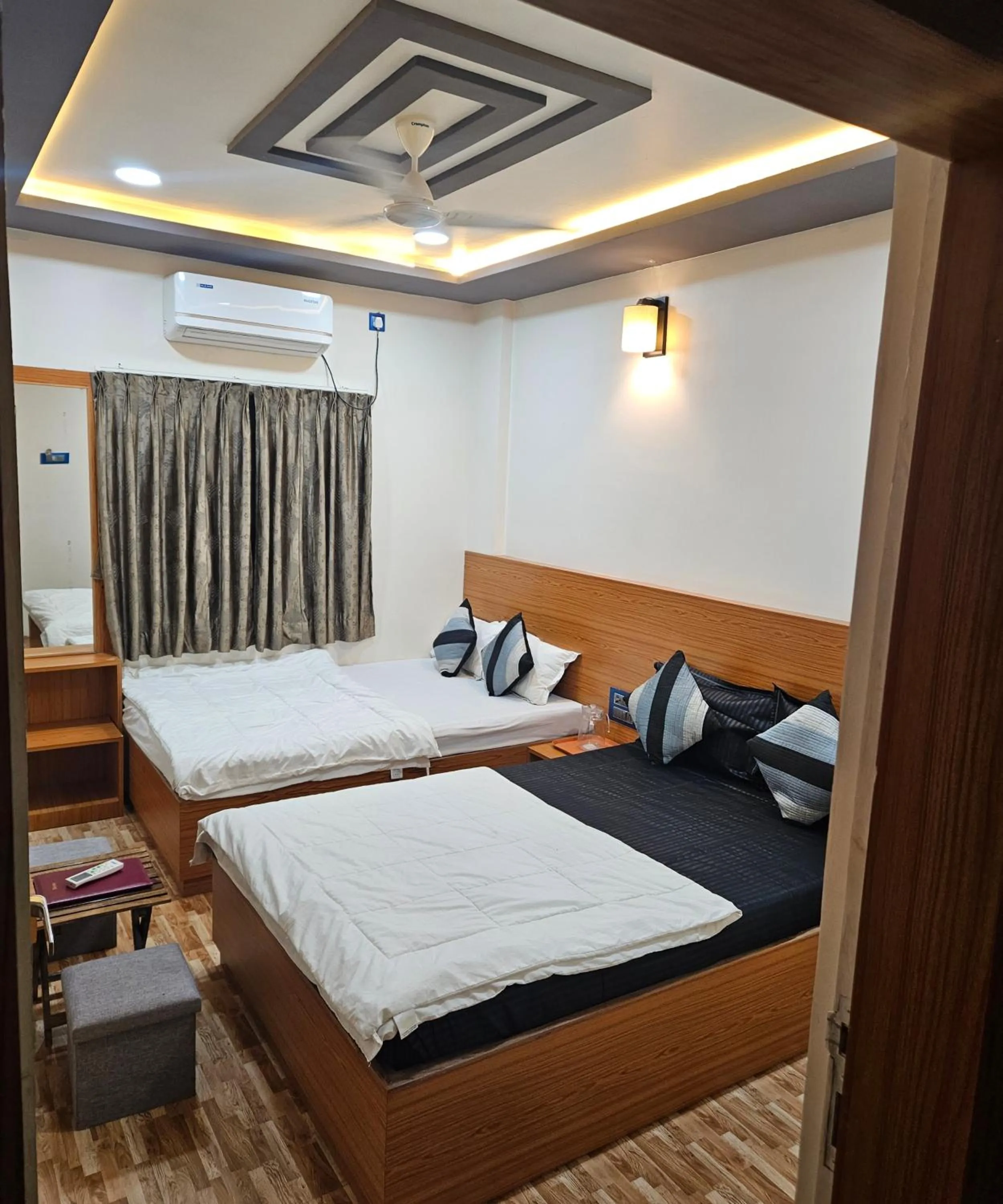 Bed in Hotel Sai Dakshina Inn & The Fern Restaurant