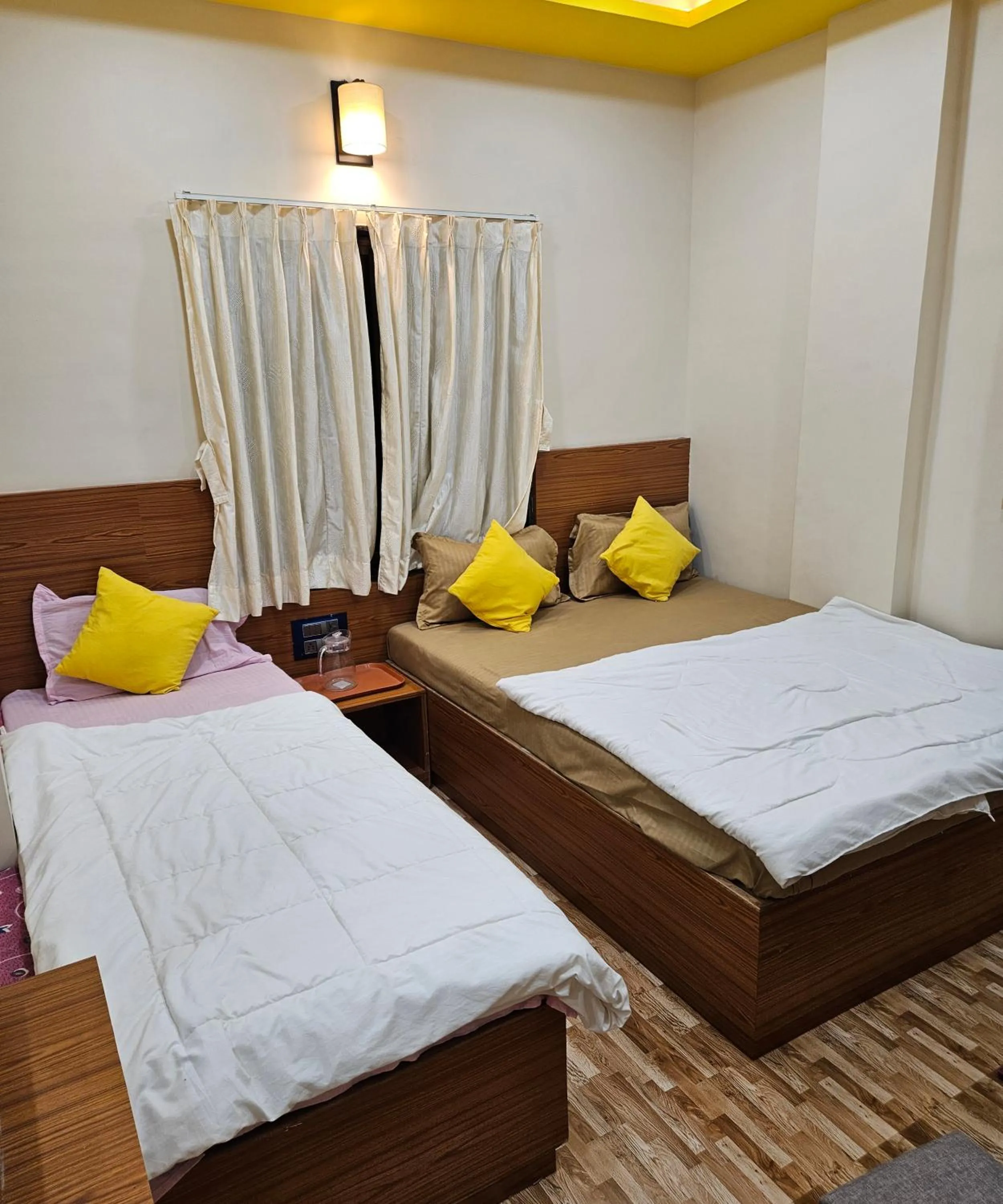 Bed in Hotel Sai Dakshina Inn & The Fern Restaurant