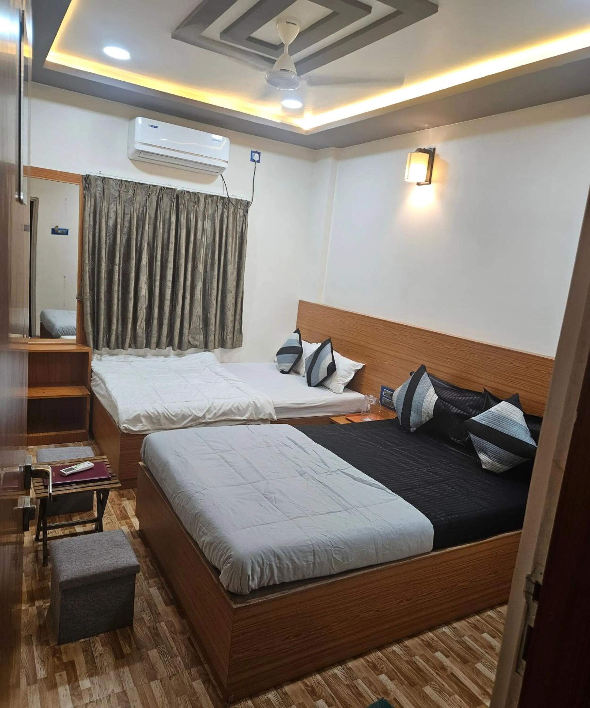 Bed in Hotel Sai Dakshina Inn & The Fern Restaurant