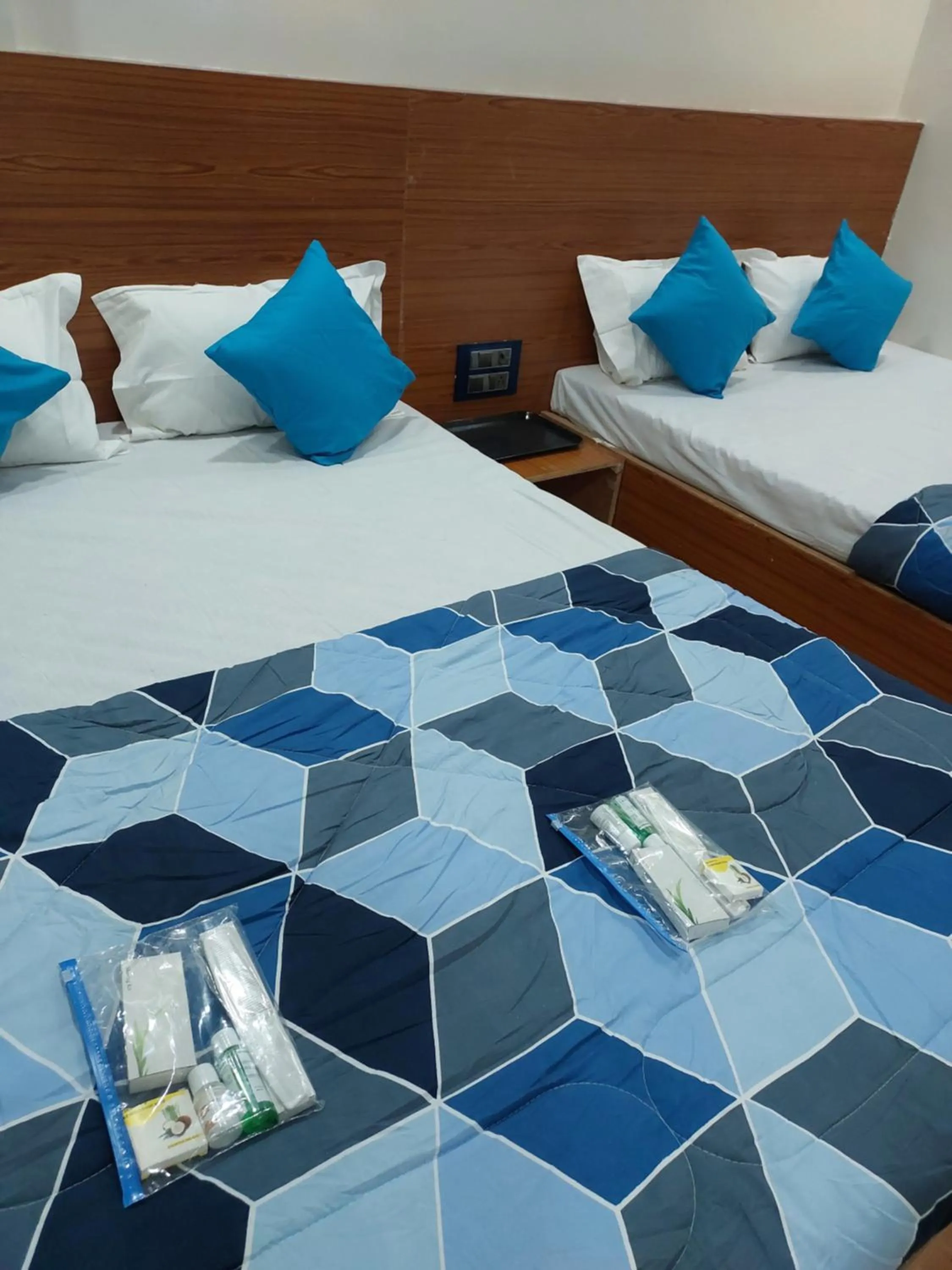 Bed in Hotel Sai Dakshina Inn & The Fern Restaurant