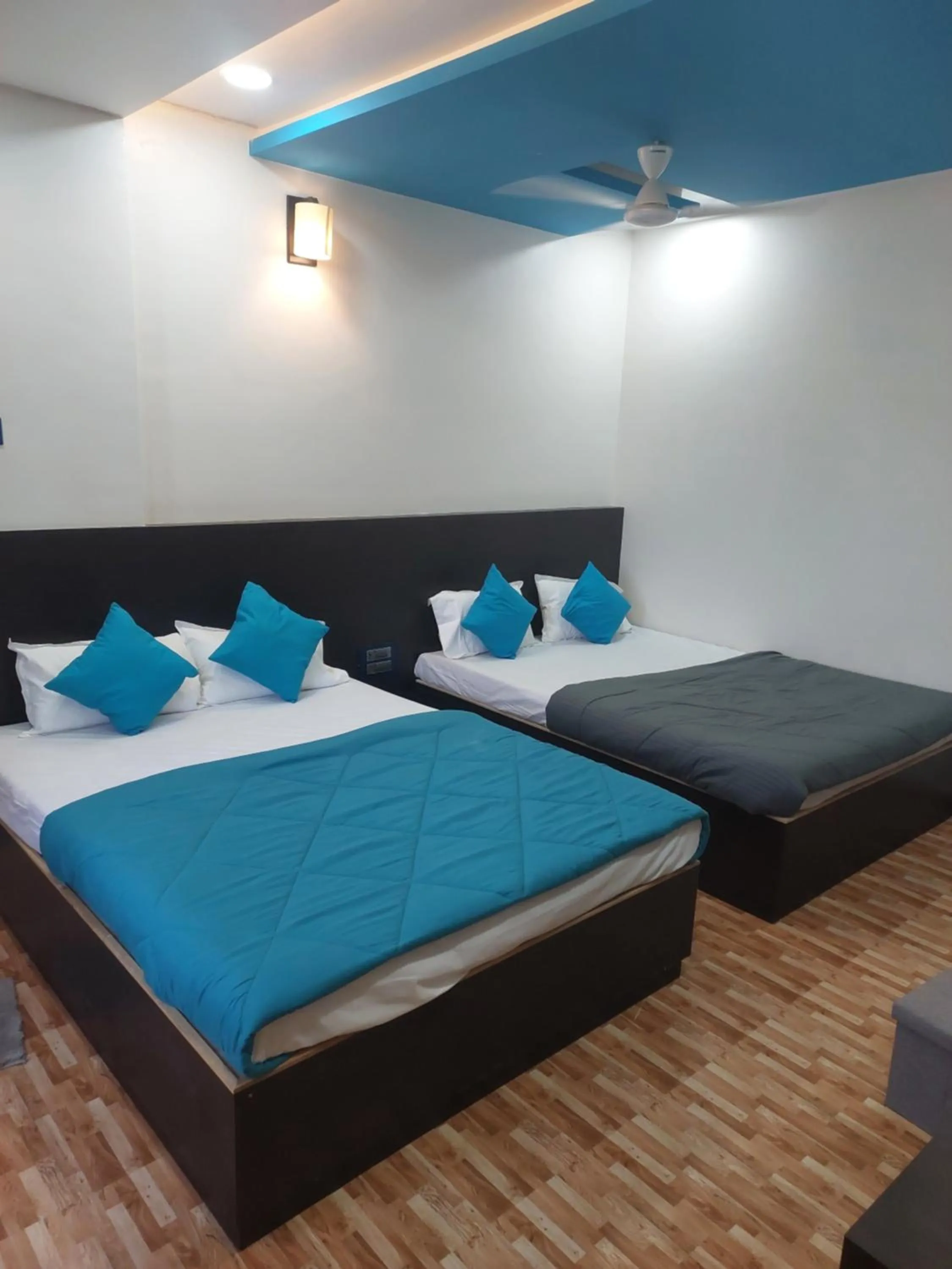 Bed in Hotel Sai Dakshina Inn & The Fern Restaurant