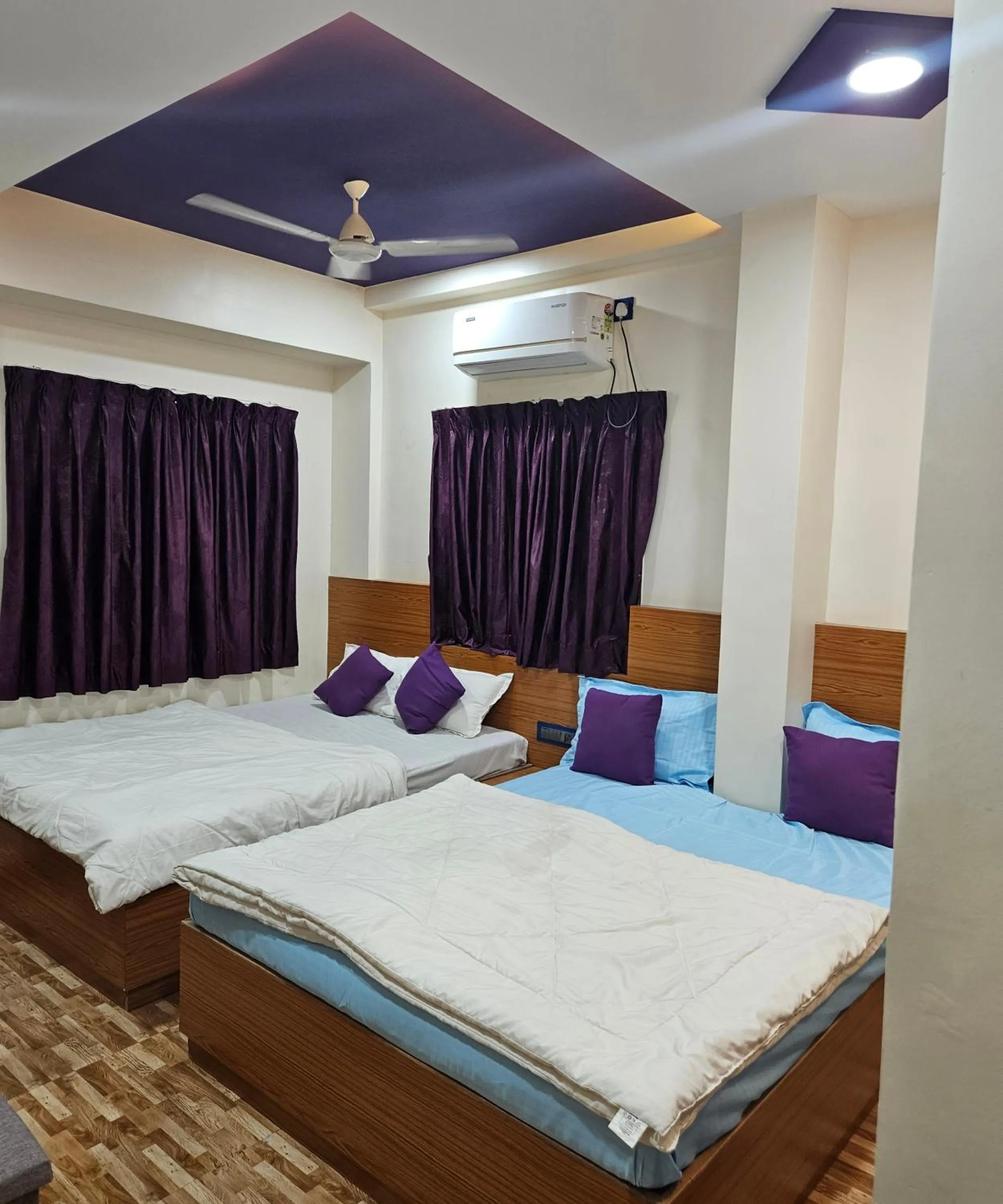 Bed in Hotel Sai Dakshina Inn & The Fern Restaurant