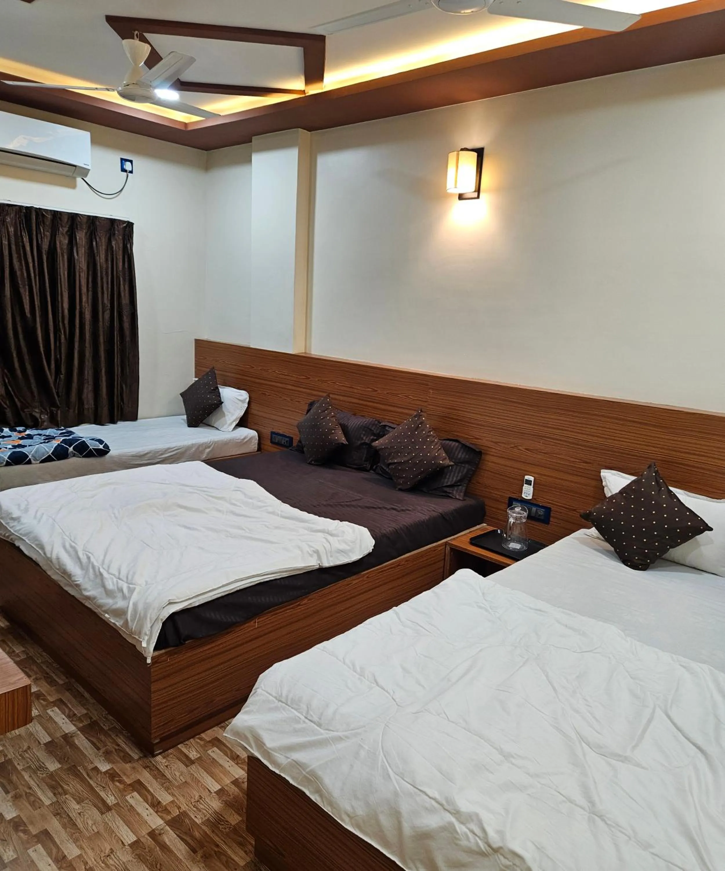 Bed in Hotel Sai Dakshina Inn & The Fern Restaurant