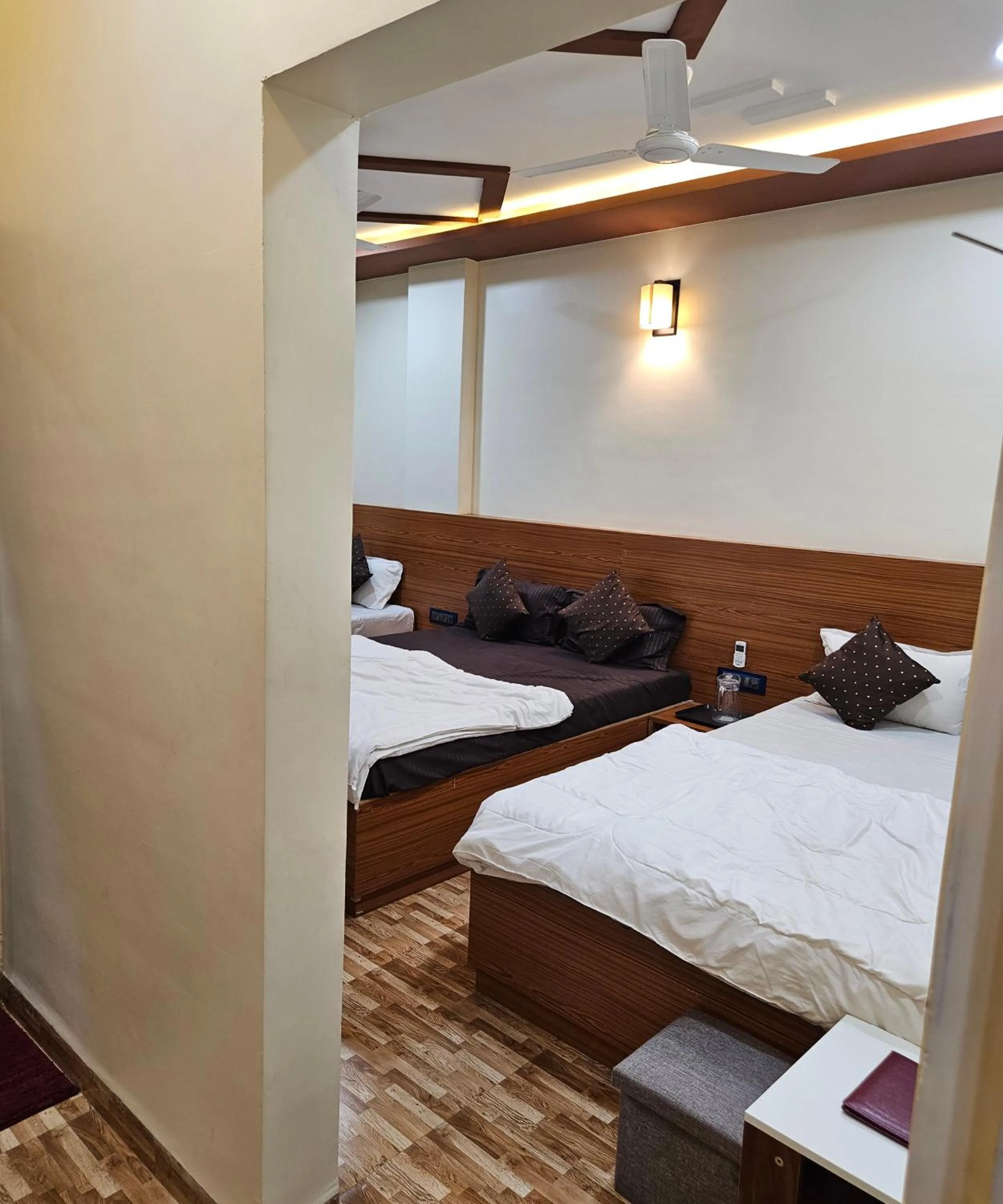 Bed in Hotel Sai Dakshina Inn & The Fern Restaurant