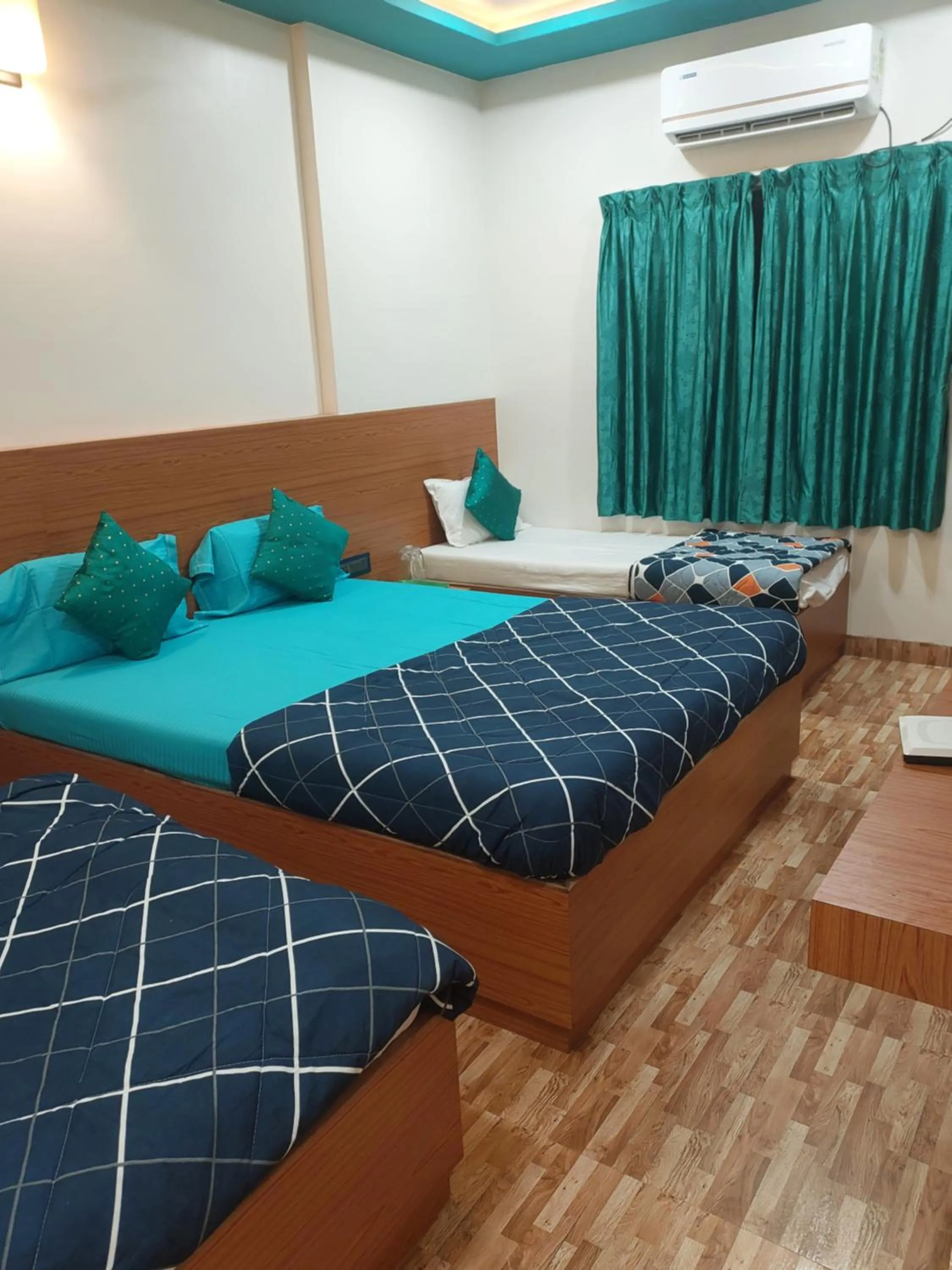 Bed in Hotel Sai Dakshina Inn & The Fern Restaurant