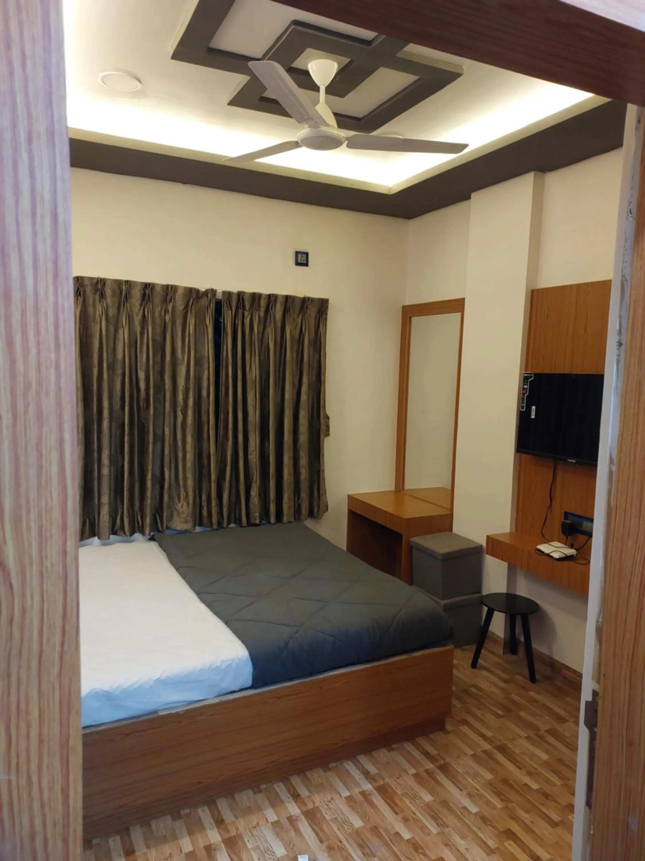 Bed in Hotel Sai Dakshina Inn & The Fern Restaurant