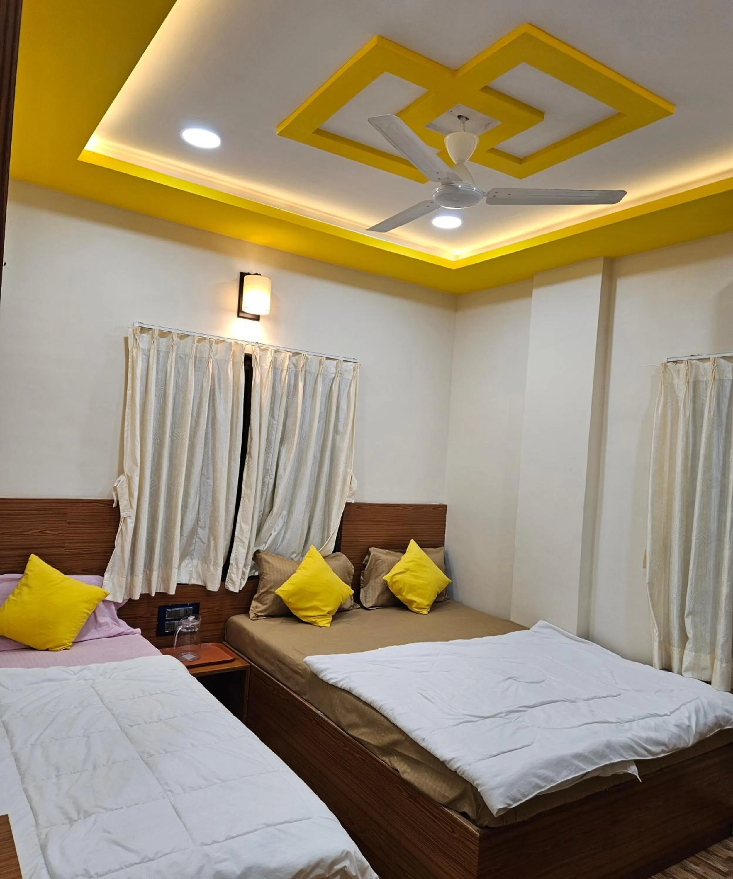 Bed in Hotel Sai Dakshina Inn & The Fern Restaurant