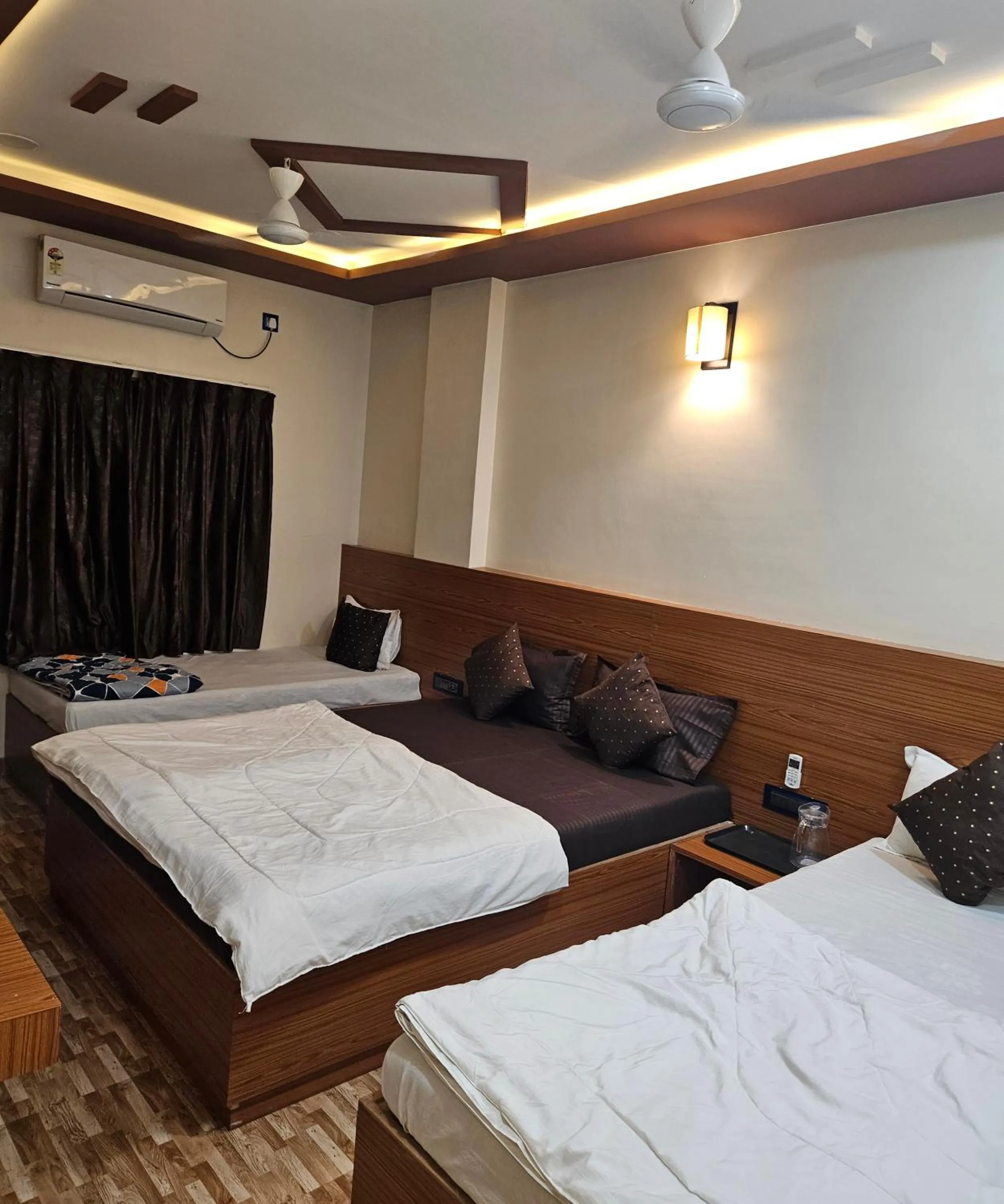 Bed in Hotel Sai Dakshina Inn & The Fern Restaurant