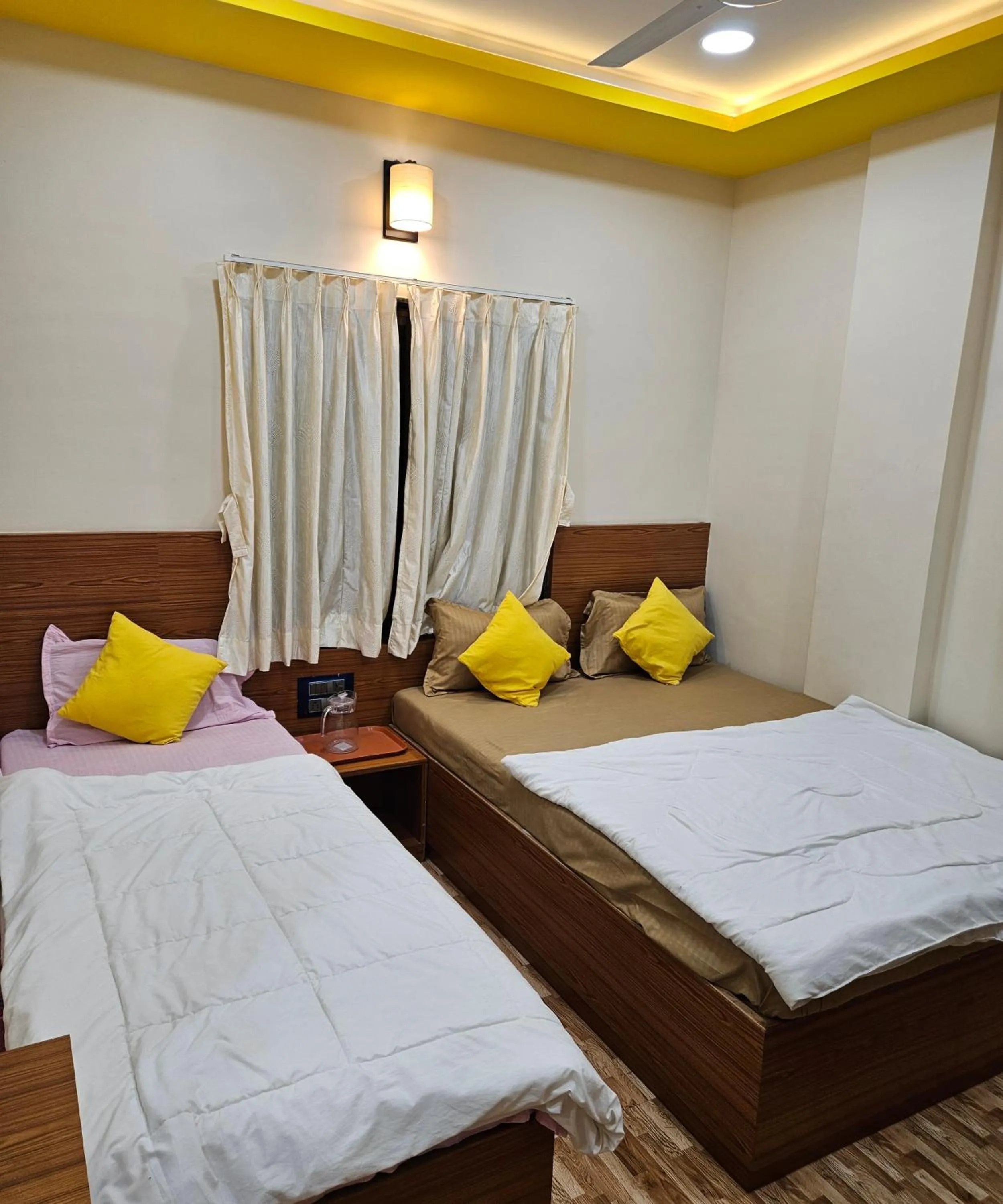 Bed in Hotel Sai Dakshina Inn & The Fern Restaurant