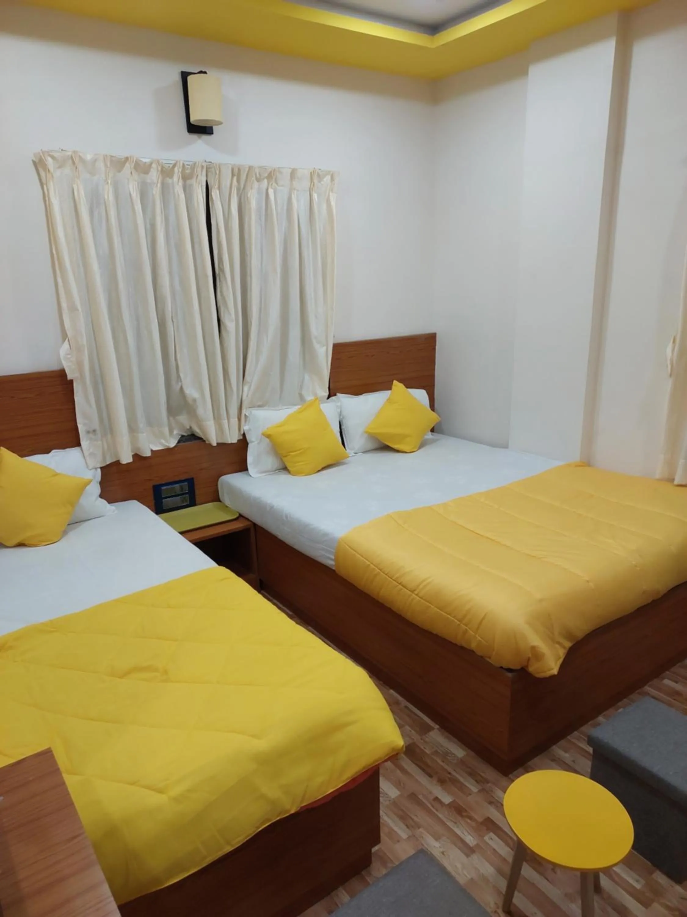 Bed in Hotel Sai Dakshina Inn & The Fern Restaurant