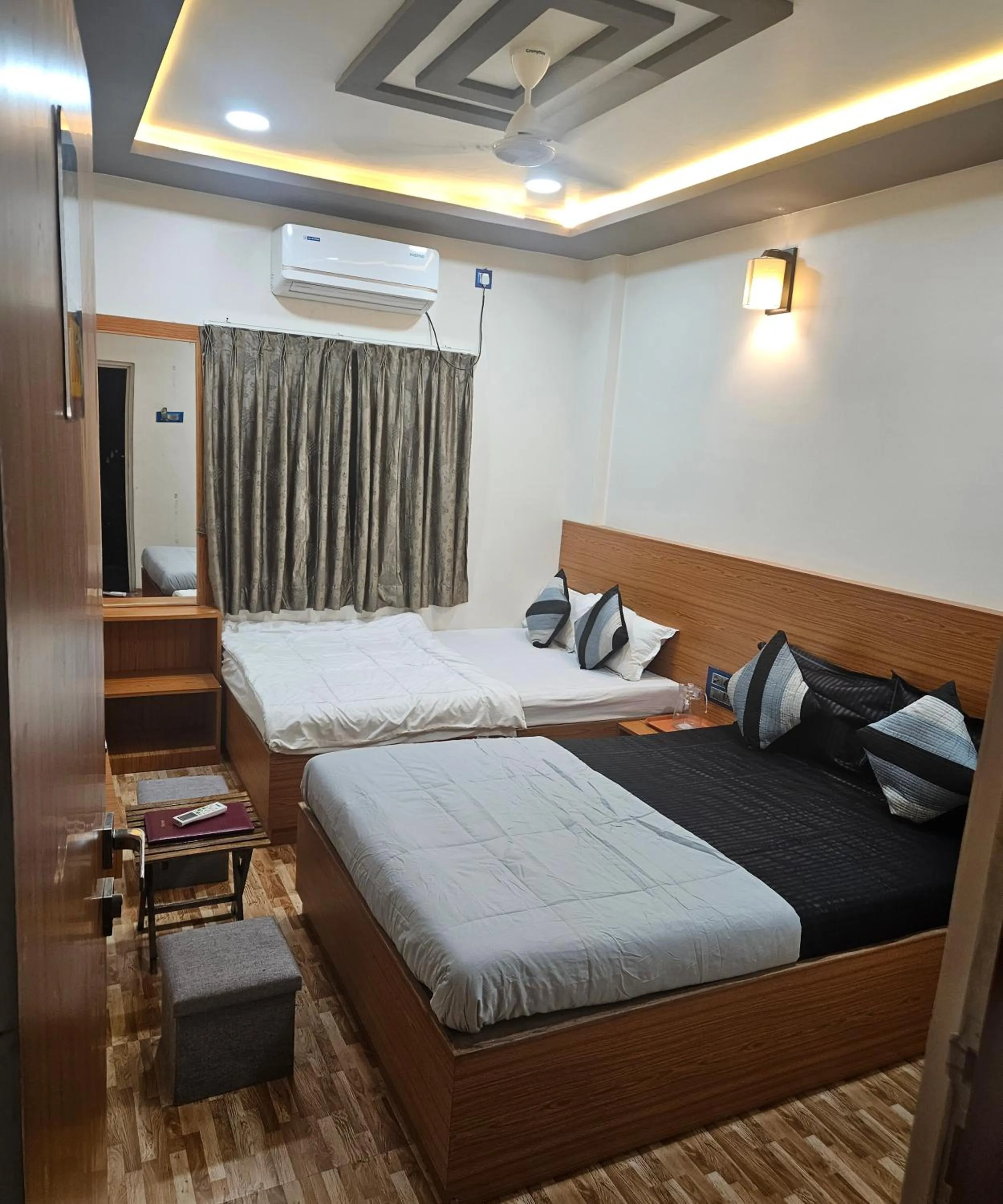 Bed in Hotel Sai Dakshina Inn & The Fern Restaurant