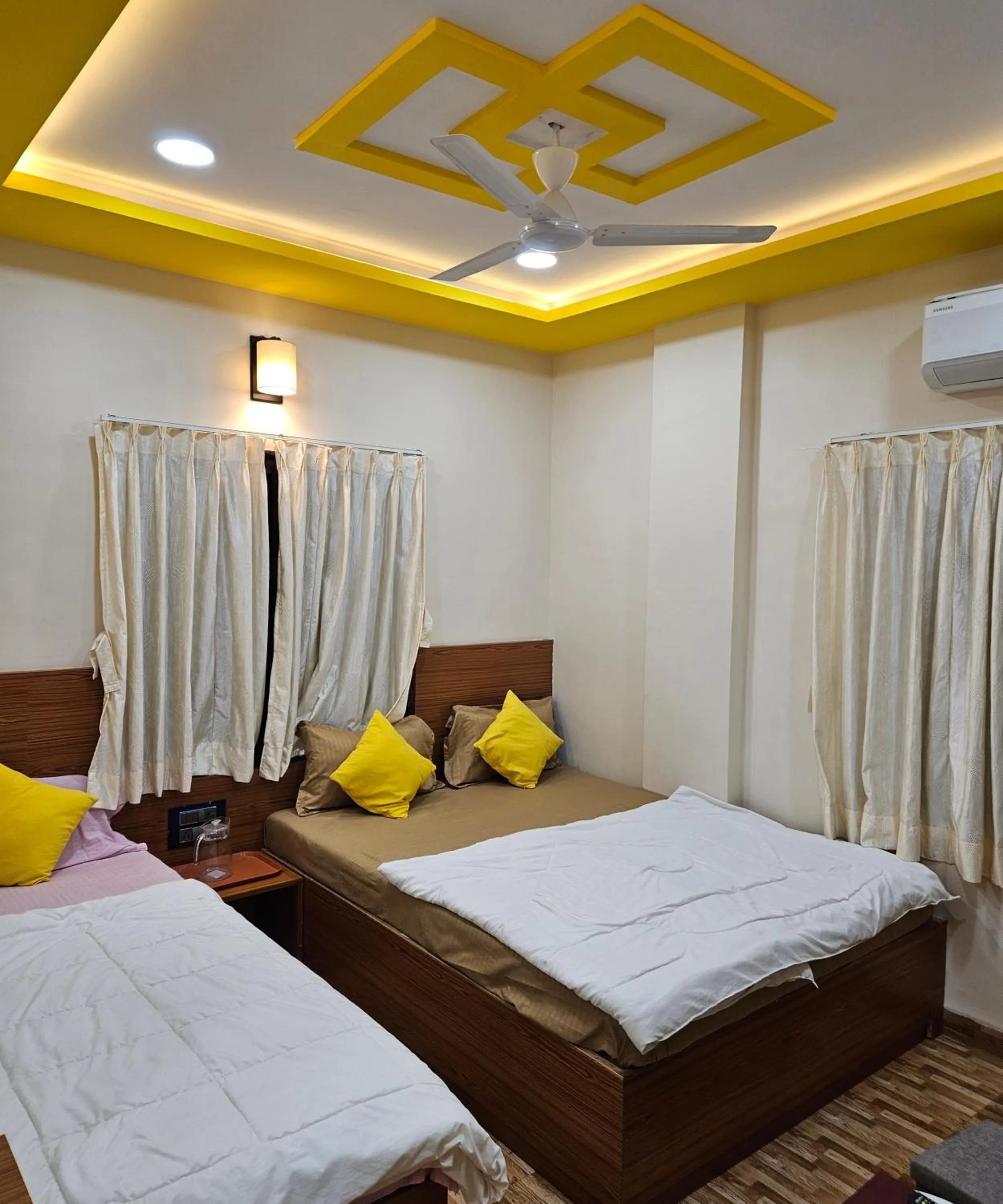 Bed in Hotel Sai Dakshina Inn & The Fern Restaurant