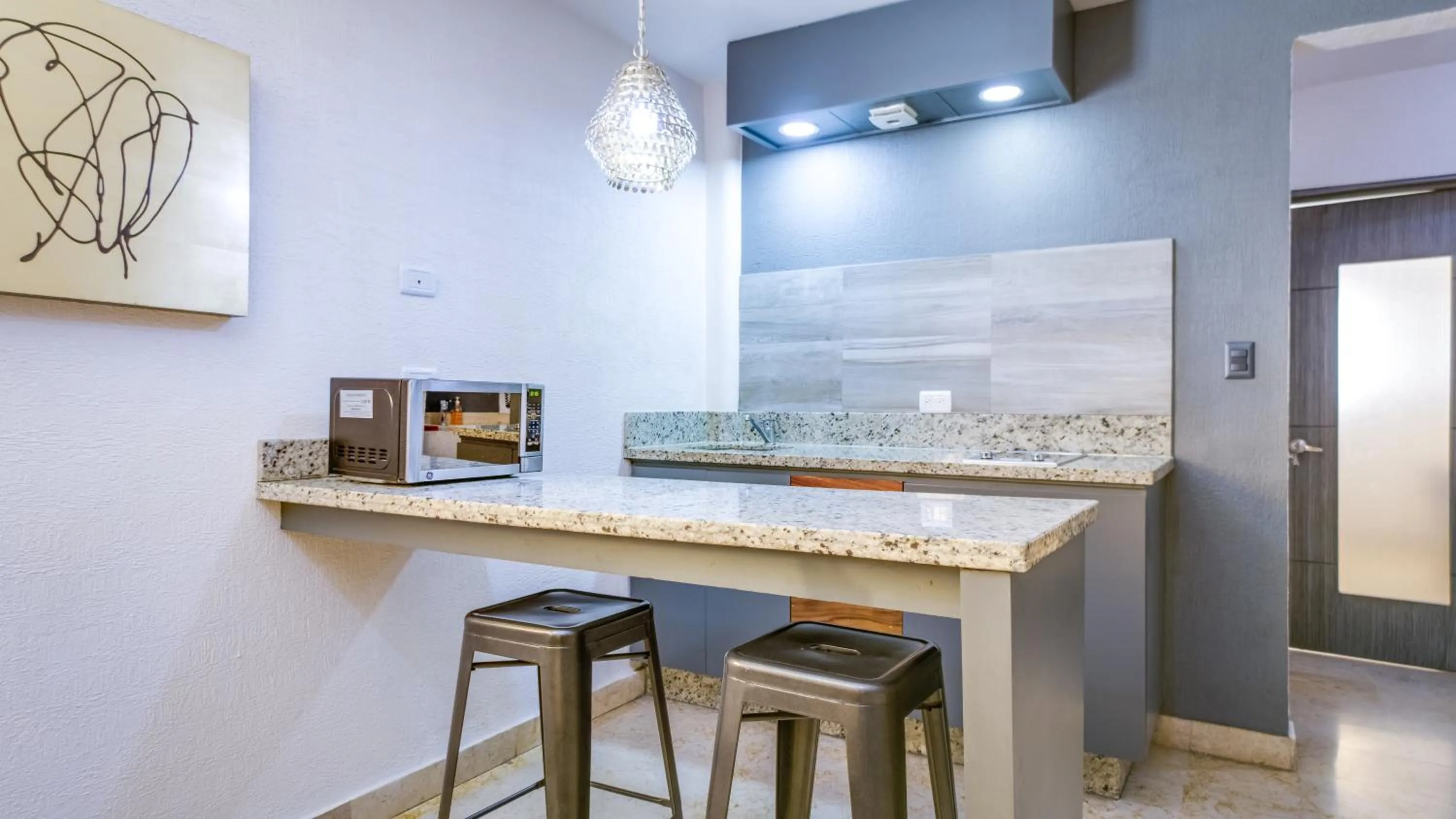 Kitchen or kitchenette in Homesuites Rotarismo