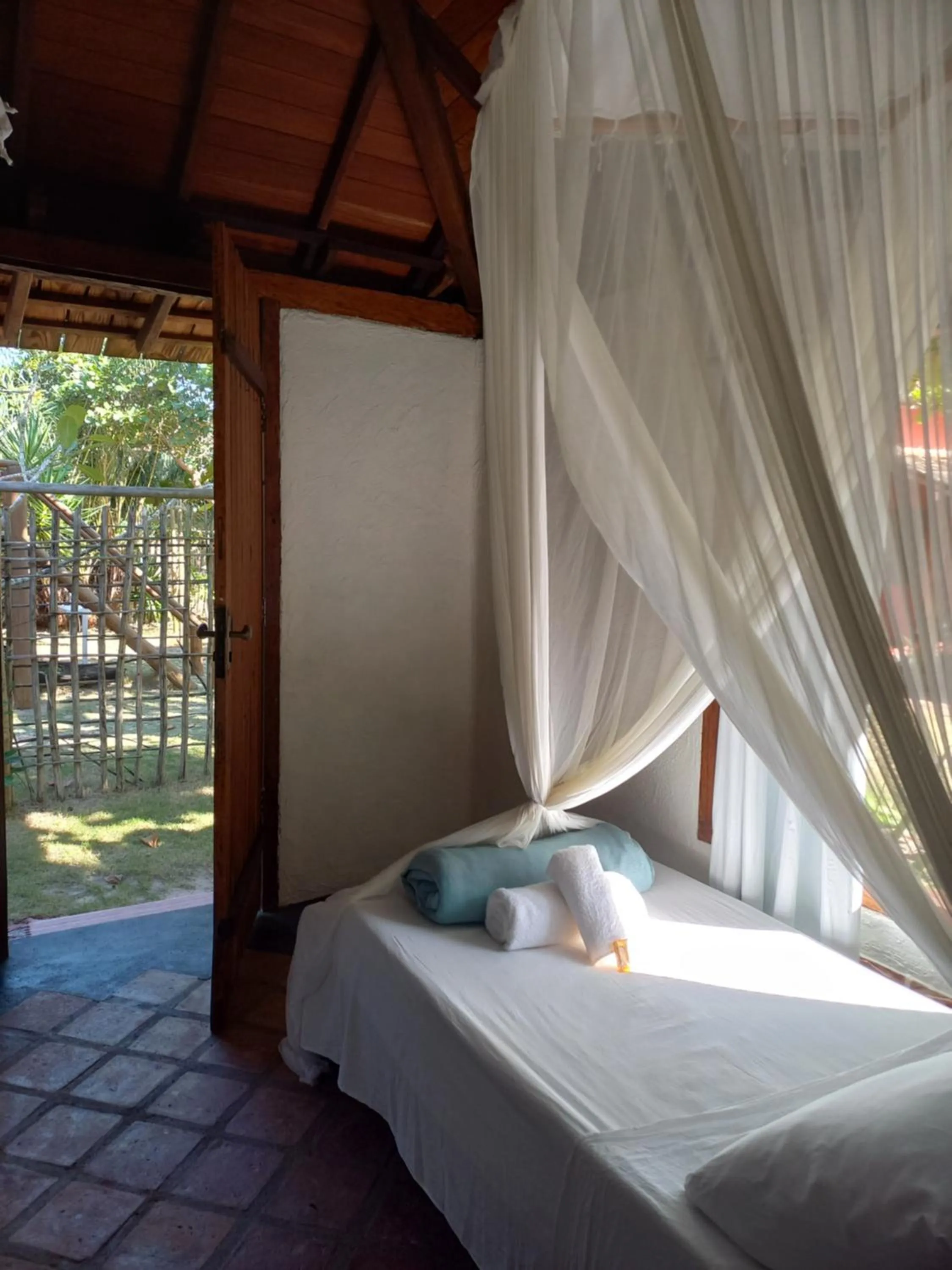 Bed in Bangalôs da Aldeia Caraiva