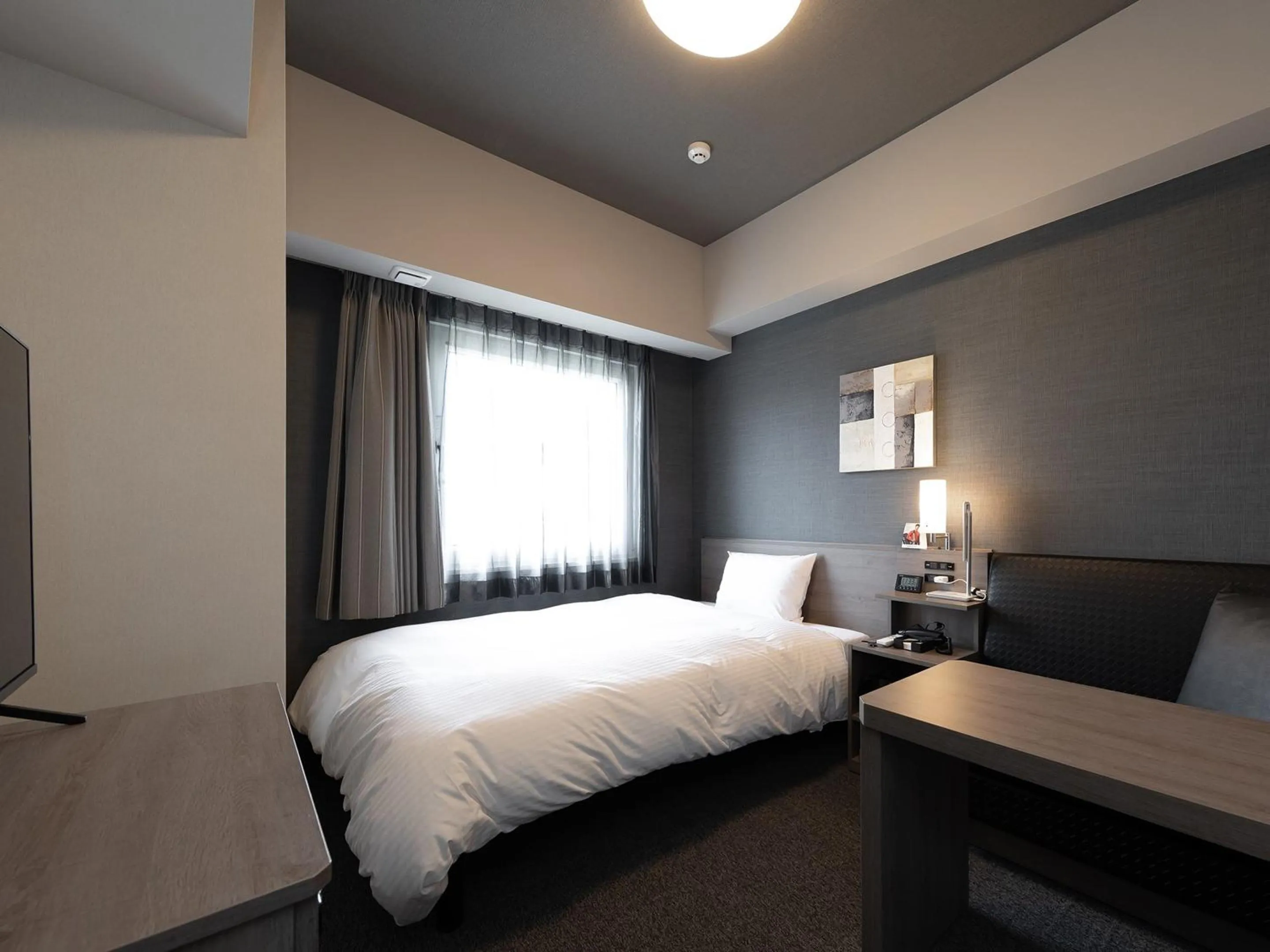 Photo of the whole room, Bed in Hotel Route Inn Kyoto Kameoka Ekimae